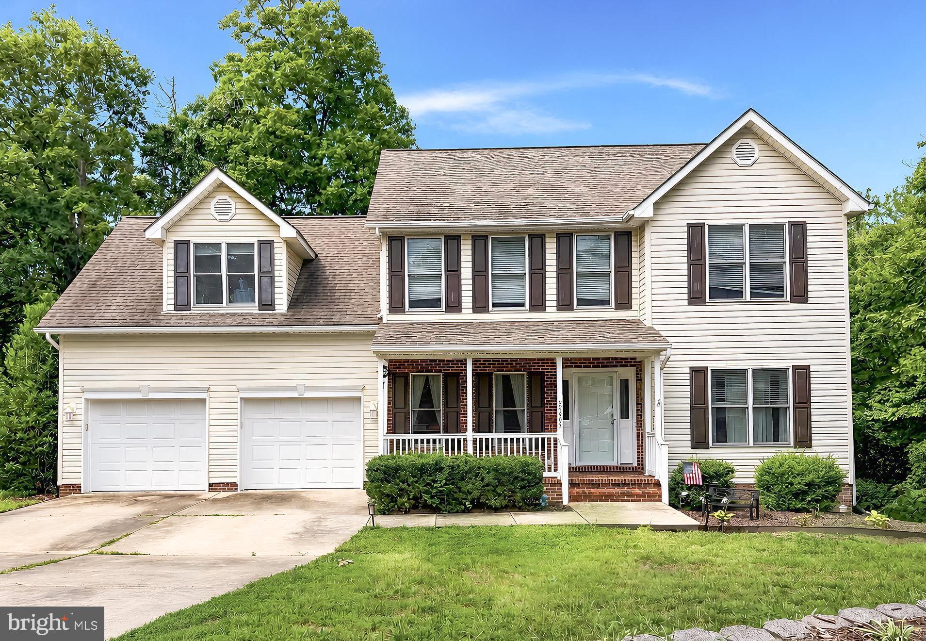 Greenview West Colonial on quiet cul-de-sac! Tucked away, but close to everything, this beautiful 4-bedroom, 3.5-bath, home features gleaming hardwood floors, 9-ft ceilings, Maple kitchen cabinets, granite counters, a large back deck, and a finished basement rec room with a walk out. A welcoming front porch leads to a foyer with a home office w/ French doors on the right, and the formal dining room w/ decorative bead board on the left. The attractive kitchen includes stainless appliances, glass-front display cabinets, a breakfast bar and an informal dining nook with ceiling fan. Sliding doors head out to the back deck with a wooded backdrop, making a great set up for entertaining. The comfortable living room centers on a gas fireplace with stone surround and wood mantel. All four bedrooms include walk-in closets, and the hardwood floors continue in two of the rooms. The updated primary bath has a tiled shower and double sinks. No lugging baskets on the stairs with the convenient upstairs laundry. The finished lower level can be used for whatever you need - games, media, hobbies, music, you name it! With a LL full bath, it can also make a great guest space.  The LL walk out leads to a big concrete patio, perfect for hanging out in the shade or firing up the grill. The fenced backyard is great for keeping pets or the kids in view. Unfinished LL space makes storage a breeze. Never run out of hot water with the tankless heater, and the two-car garage keep cars warm and dry.  It's only minutes to PAX, shopping, restaurants and main commuter routes. Don't miss your opportunity for a tour of this beautiful home, request your showing today!