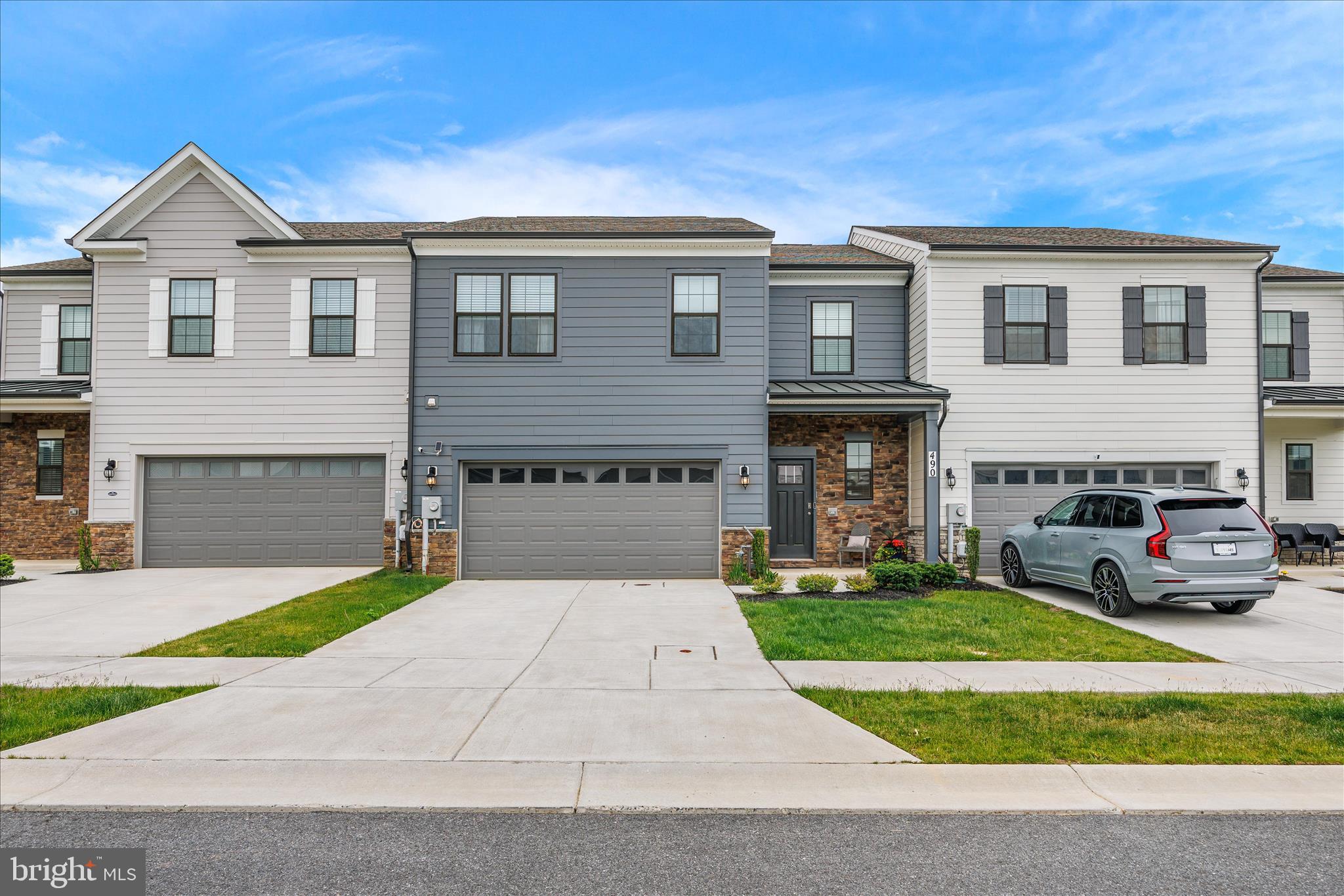Rarely available and approximately 2500 Sq. Ft, "Villa"  style townhouse in Renn Quarter Neighborhood.  The "Villa"  floor plan is rarely available in Renn Quarter neighborhood.  Upon entry you are met by an expanded foyer that leads to stairs to go upstairs,  access to a two car garage, main level  powder room and storage closet.  The first floor open concept floor plan includes luxury flooring and LED surface lighting throughout the kitchen, dining and living areas.  Kitchen includes 42 inch white cabinets with satin black hardware, quartz counters, herringbone style backsplash, stainless Whirlpool Appliances including, cooktop, wall oven, microwave, dishwasher and refrigerator with icemaker and large kitchen island that is perfect for entertaining.  Kitchen also includes a full size pantry and walk-in laundry room that includes High Efficiency LG Mega Capacity Washer and Dryer and flows into aa combination living and dining area with custom fixtures and exterior access to an enclosed back yard.  Off the living area is the primary bedroom with an ensuite primary bathroom that includes a custom barn door, stand-in-shower with tile and glass doors,  tile flooring throughout, quartz counters and storage cabinets with satin black hardware.  The primary bathroom leads to an expansive walk-in closet , with a storage system.  Upstairs, you are met by a media room loft space that can also be used as an office area.  The second primary bedroom upstairs includes a second ensuite bathroom with tub/shower combo and walk in closet.  The third bedroom can alternatively be used as an office and has access to a third full bathroom with tub/shower combo.  Renn Quarter is a growing community that includes Gym, Seasonal Pool, Dog Park, Trash and Recycling Service, Front Yard Landscaping, Snow Removal, Playgrounds for outdoor entertaining and a future Riverwalk path that will lead directly into Downtown Frederick.  The home is located near Fort Detrick, Camp David, Frederick Municipal Airport and major commuter Interstates 270/70/15.  Come by and see it today!