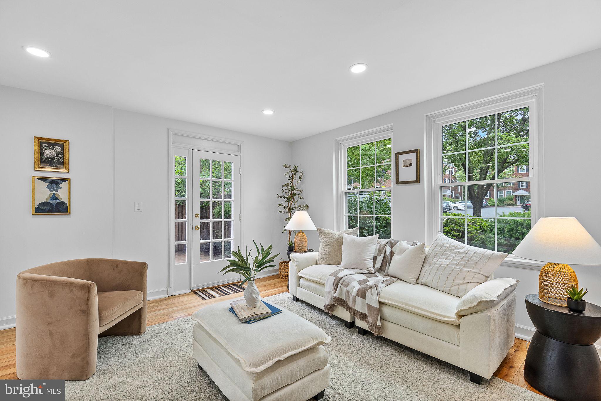 Rare, coveted Dominion II model END-UNIT located in sought-after Fairlington Villages. Two bedrooms and bathroom on the Upper Level, plus a  den/office/bedroom and bathroom on the Lower Level. This large, 1,689 square foot, three-level home showcases $90,000 worth of renovations that make this a turnkey home. This sun-soaked end unit features NEW hardwood flooring in the Primary Bedroom, as well as REFINISHED hardwood floors on the Second Bedroom, Upper Level Hallway, and Main Levels, NEW Luxury Vinyl Tile on the Lower Level, UPGRADED granite kitchen countertops, NEW kitchen appliances, a fully UPDATED bathroom, as well as ALL NEW windows and storm doors! NEWLY installed recessed lighting on the Main and Lower Levels creates a modern look and complements the ample natural light well. FRESH paint throughout. WALK-OUT basement lends itself to ease of entry, abundant natural light, and STORAGE. Outdoor space includes LARGE patio with NEW fencing, as well as mature landscaping that shows pride in ownership. Azaleas, roses, hydrangeas, tulips, daffodils, and hyacinths increase curb appeal and make this unit into more than just a place to live. Parking is a breeze in Lot #41, with more than enough spaces. Listed on the National Register of Historic Places, Fairlington has more than just its past to offer, boasting community features such as the neighborhood pool, tennis and basketball courts, playground, and even its very own (and very popular) Farmers Market, which are all conveniently situated steps away from this unit. Fairlington Villages has a strong sense of community, with events like wine and cheese tastings, Easter Egg Hunts, parades, holiday parties, and more! The surrounding area has a lot to offer as well. Shirlington Village is only a mile away, which means easy access to shopping, whether at a boutique store or at Harris Teeter, local dining, such as Busboys and Poets, Astro Beer Hall, Our Mom Eugenia, and Taco Bamba, as well as great entertainment options such as the Signature Theatre and AMC Shirlington 7.  For those who love the outdoors, there are plenty of options, including the W&OD Trail, Shirlington Dog Park, and Jennie Dean Park. Travel is easy with close access to commuter routes, Metrobus just 0.2 miles away, and King Street Metro only 3 miles away. Live where you can be comfortable at home, in your community, and beyond.