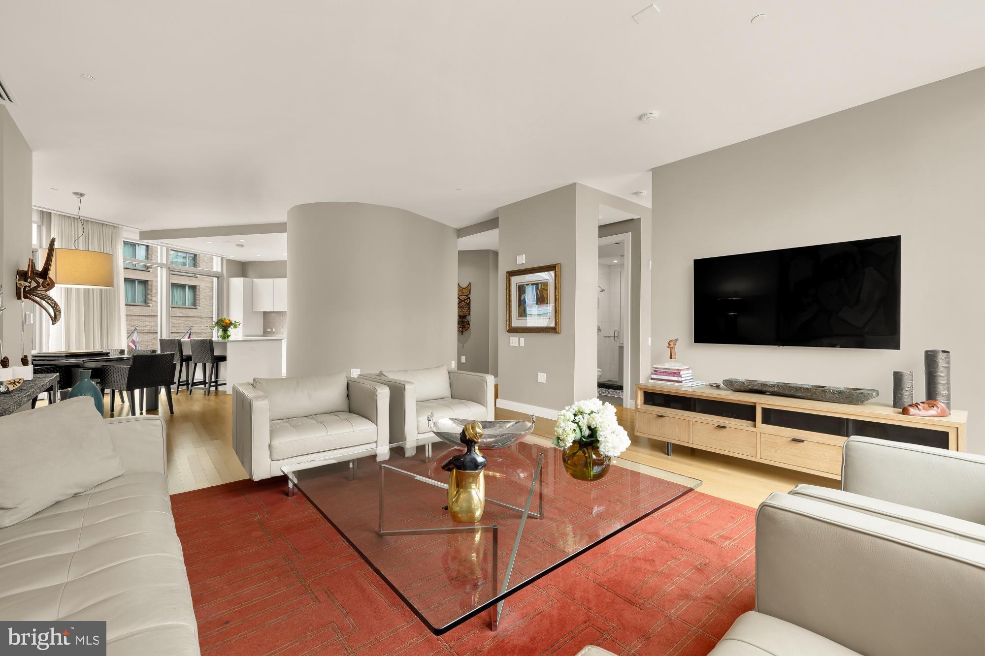 Experience the height of West End luxury at 22 West, one of the city’s most iconic contemporary residences. This sprawling 2-bedroom plus den, 3 full bathroom condo offers an expansive layout wrapped in floor-to-ceiling windows, bathing the space in light from both eastern and western exposures. Rich oak floors run throughout the home leading you into an expansive living room that flows effortlessly into a dedicated dining space creating a sophisticated backdrop for elegant entertaining with city views. 

The culinary center is a chef’s dream, anchored by sleek granite surfaces, high-performance Bosch and Sub-Zero appliances, Poggenpohl cabinetry and further enhanced by a dedicated kitchen pantry for effortless organization. 

The versatile den provides the perfect footprint for a quiet home office or can easily be converted into a full third bedroom to suit your needs. Tucked away for ultimate convenience, the residence features a true laundry room equipped with side-by-side Bosch appliances and cabinets. Throughout the home, extensive closet systems and clever storage solutions ensure that every personal item has its place, maintaining the sleek aesthetic of the space.

Beyond the private quarters, the lifestyle at 1177 K St NW is defined by convenience and ease. Life at 22 West means world-class amenities are always at your fingertips. Take in the city views from the rooftop pool, stay active in the fitness center, enjoy the community lounge and roof terrace with dining tables and grill, and enjoy the peace of mind provided by a 24-hour concierge. 

Your monthly fee covers all utilities, and the residence comes complete with two dedicated parking spaces and a large storage unit.  All utilities are included in the condo fee including gas, electric, high speed internet, TV, water, sewer and trash removal, making for maintenance-free living. 

Outside your front door, the West End is your playground. With a Walk Score of 98, you are moments from morning lattes at Tatte, dinners at Rasika, Chef Geoff’s, RIS DC, and Blue Duck Tavern and the convenience of shopping at Whole Foods, Trader Joes, and Walgreens. Equinox, with its renowned fitness facilities, is right across the street for your workout routine, and the historic charm of both Dupont Circle and Georgetown are just a few blocks away. This is sophisticated urban living at its finest.