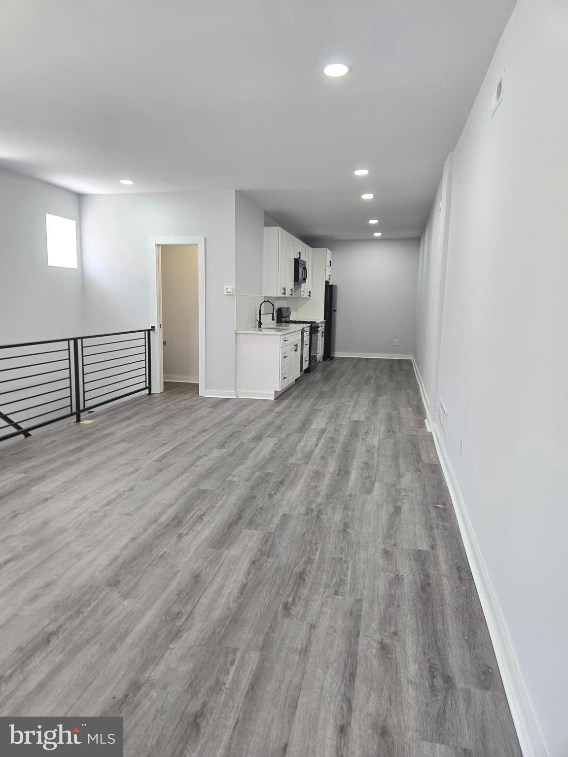 Spacious 2 bed, 2.5 bath bi-level apartment in the heart of Olde Kensington with 1-car GARAGE PARKING! This bright corner unit offers 1,300 sq ft of living space with an open layout, modern kitchen, and a convenient half bath on the main floor. The lower level features a second living area, in-unit laundry, and two bedrooms—each with a private full bath and generous closet space. Pet-friendly with fees. Steps from Reanimator Coffee, Helm, and close to Fishtown, Northern Liberties, and public transit. All square footage numbers are approximate and should be verified by the buyer. It is the responsibility of the buyer to verify real estate taxes.