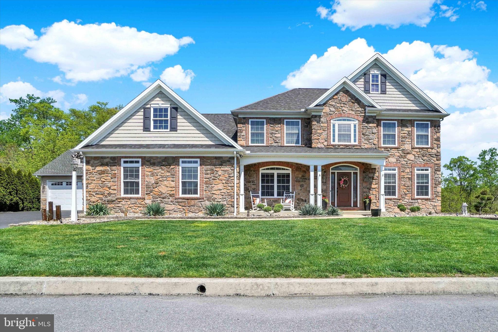 This impeccably designed, luxury home is better than new with a 1st floor primary suite, finished lower level, 4-car garage & in-ground salt water pool. Inside and out, this home offers what many are lacking-- space to spread out! Above grade and below grade finished square footage combined totals more than 5,000+ sqft! The heart of the home is a showstopping living room with coffered ceiling, custom built-in bookshelves, cozy fireplace & a trio of tall windows with transoms. The kitchen is both stunning & functional complete with solid wood cabinetry, granite countertops, stainless steel appliances (double ovens, new dishwasher (2025) & built-in ice maker!), tiled backsplash, pantry, and center island. Enjoy meals either in the formal dining room with classic details like chair rail/moldings or in the windowed breakfast nook with fantastic views year-round and easy access to the deck. Working from home? There is a dedicated office off of the foyer that offers privacy while still remaining connected to the main living space. True one-floor-living is possible in this home with an outstanding primary suite on the 1st floor complete with spacious bedroom, double closets, and full bathroom with double sinks/vanities, and a tiled walk-in shower. Not to be outdone, upstairs you'll find the second primary suite, a tranquil retreat with tray ceiling, enough room to comfortably fit a king sized bed, walk-in closet, and attached full bathroom equipped with soaking tub, tiled shower with bench, and tons of storage in the oversized vanity. There are 3 additional bedrooms on the 2nd floor, each with unique features: one bedroom has a private attached full bathroom, one bedroom has huge double closets, and the last bedroom is cheerful with a custom painted mural. Laundry on the 2nd floor is complete with Speed Queen washer and dryer (2025), sink, and storage. Head downstairs to see a lower level done right! This daylight, walk-out basement boasts full size windows and access to the covered patio. The family room is spacious and versatile with stone accents, double-sided fireplace, and full bathroom. Step outside to experience exceptional outdoor living. Perfectly perched on a nearly half acre lot, the spectacular outdoor space begins on the full length composite deck offering privacy and picturesque views of nature. The 30+ potted plants are low maintenance thanks to a custom Rainbird drip irrigation system that waters them for you! 3 staircases connect the upper deck to the lush lawn and the patios below. The sparkling 55' x 35' saltwater, gunite pool surrounded by expansive paver patios create a backyard that would be impossible to replicate. The outdoor stereo system and Haywood 550k BTU pool heater (2026) help to make this space enviably comfortable. Glimmering lights placed along the landscape, stairways, pathways, and retaining walls light space beautifully. A truly custom backyard oasis wouldn't be complete without an Alfresco outdoor kitchen equipped with fridge, sink, full sized grill, and two cooktops! Enjoy meals under the 14' x 14' gazebo with wood beam accents or relax and unwind around the built-in firepit. A built-in shed tucked under the deck keeps toys and pool equipment nice and tidy. This backyard is nothing short of spectacular! Every home needs good “bones” and this home boasts features meant for peace of mind including instant hot water from 2 tankless hot water heaters, 5 ton A/C unit (2025), Honeywell security system on all windows and doors, Outdoor camera security system, and even a fully integrated window candle system. The unbelievable construction of this home extends even to the garage with 2-car bays attached and an additional 2-bays in the oversized detached garage equipped with an RV hookup. The next owner will undoubtedly appreciate the superb pride of ownership, spectacular quality construction, and generous space this Hampden Summit, CVSD home provides.