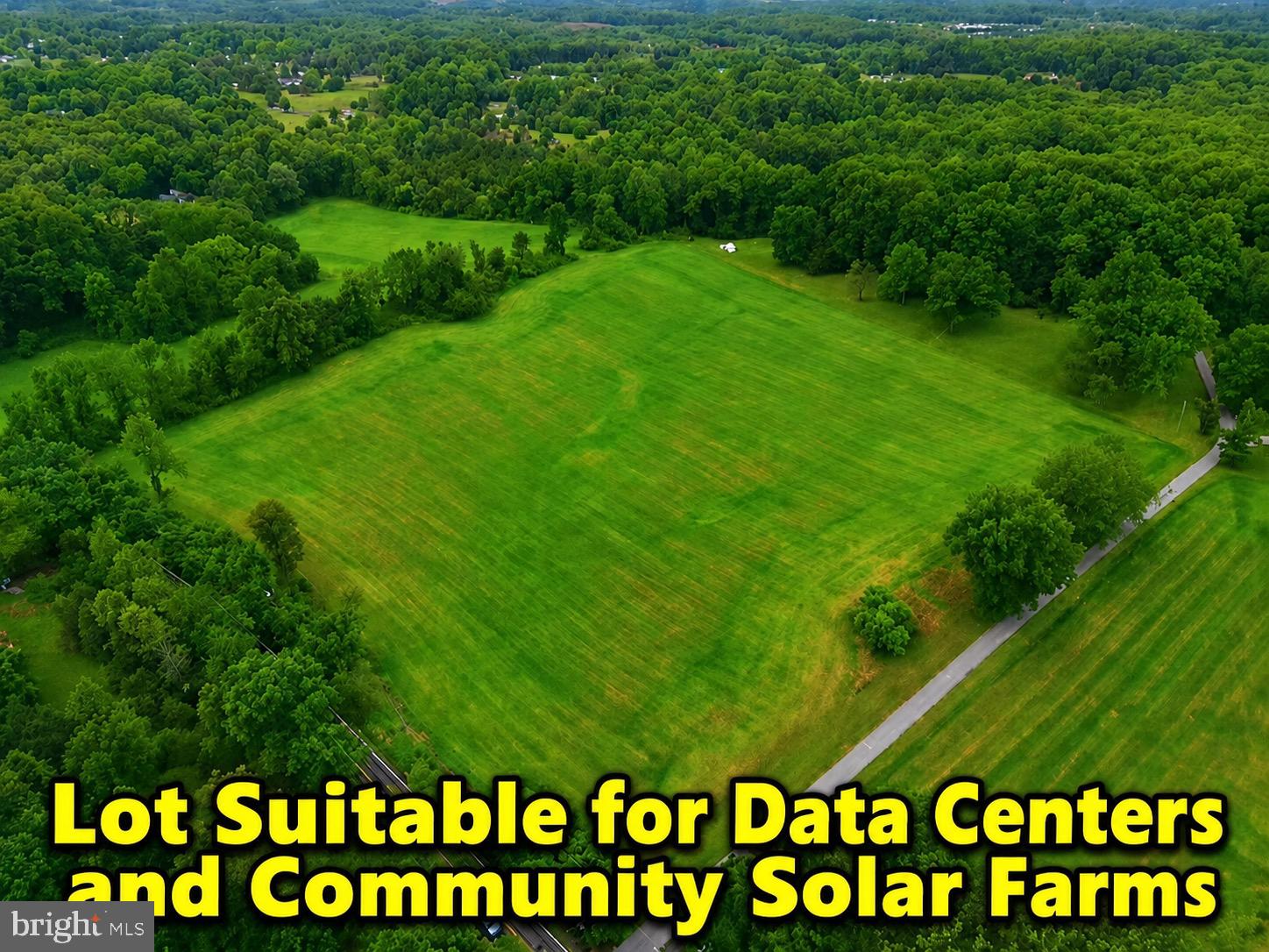 LOT SUITABLE FOR DATA CENTERS AND COMMUNITY SOLAR FARMS.

11.85 scenic acres with five identified perk areas. Property known as N907 is being sold strictly AS IS. Zoned RC (Rural Cluster), the property offers a variety of permitted and special exception uses, presenting a compelling opportunity for builders, developers, investors, or end users seeking future upside. Under current RC zoning, the property presently supports two lots; however, buyers are encouraged to conduct their own due diligence with the county regarding any additional possibilities or future potential uses, including potential suitability for data centers and community solar farm applications subject to county approval and zoning requirements. The land is predominantly level and offers a beautiful setting with a planned separate access point onto Ashton Road. Buyer will be responsible for drilling the well.