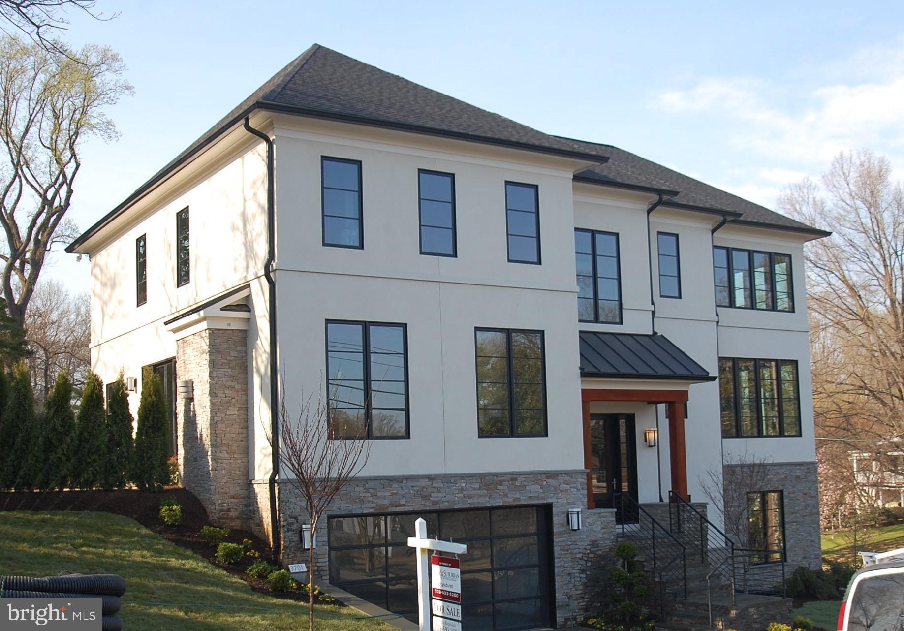Spectacular price for this New Contemporary  with stone and (real) stucco exterior and a flowing open interior. Formal Conservatory with 12' ceilings and dramatic granite wall with linear fireplace. Perfect Kitchen, large Morning Room and Family Room open to an amazing patio and fire-pit through 10' glass doors. Resort style Master Bath and huge walk-in closet. Main Level sunny private Office, bonus room on the bedroom Level. Original design- truly unique. Built by TJO Company.  Professionally landscaped with outdoor lighting, best quality throughout.