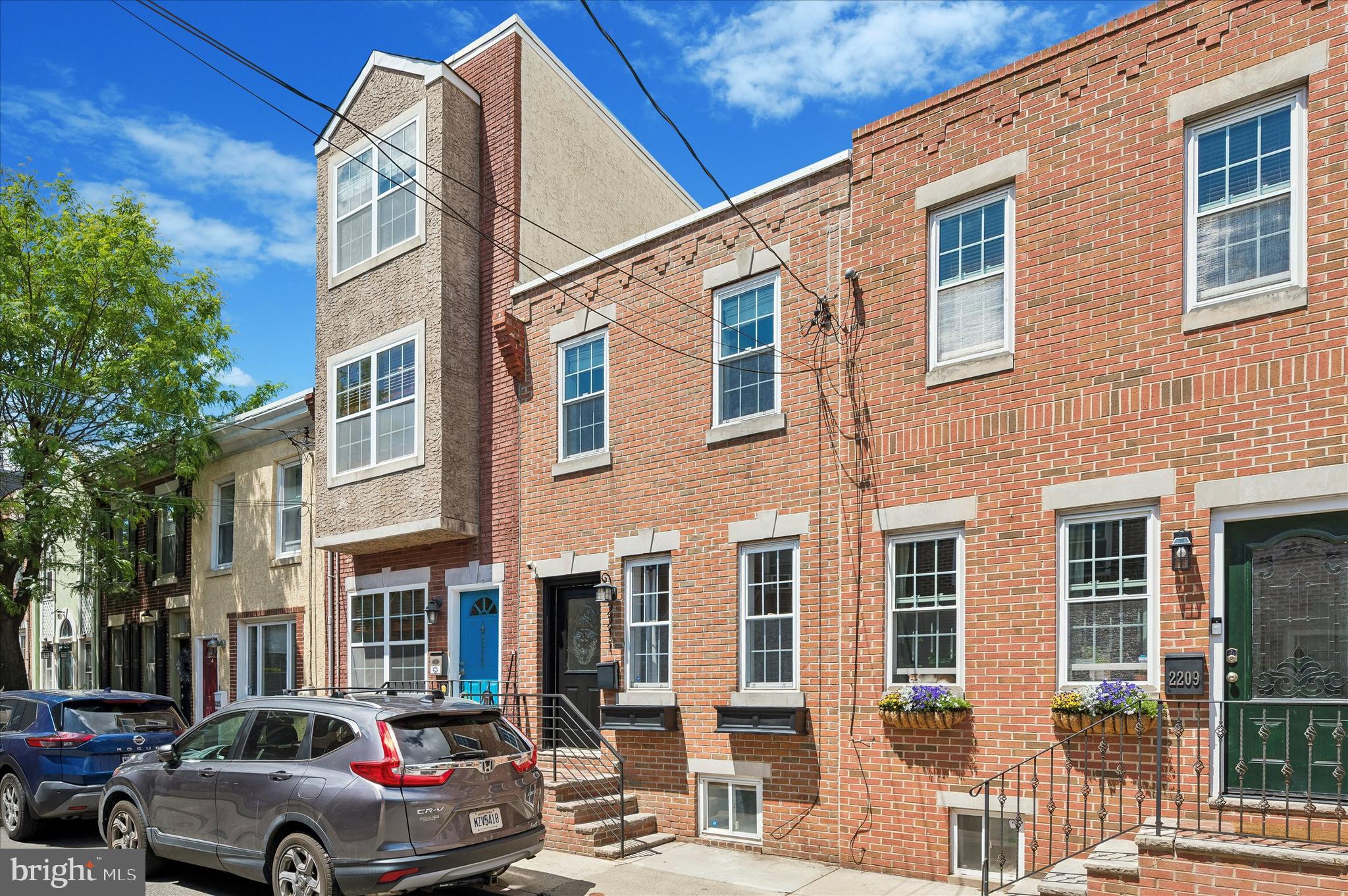 Welcome to 2211 Kimball, a beautifully updated and sun drenched 2 bedroom, 2 full bathroom home with finished basement situated on one of the most charming and desirable blocks in the heart of Graduate Hospital! If you are looking for modern luxury amidst neighborhood charm, look no further! Head inside and immediately notice the open floor plan and deep lot, allowing plenty of space for a full living room and separate dining room. Wide plank hardwood floors throughout! You are immediately drawn to the amazing, recently updated kitchen, which includes quartz countertops, stainless steel GE appliances, and a marble herringbone style backsplash! Just off the kitchen is a generous, fully fenced rear yard, perfect for all outdoor activities! Immediately notice the skylight as you head upstairs, which allows natural light to fill the space. Two spacious bedrooms here, including a primary suite with an en-suite bathroom and multiple storage closets! Don't miss the finished basement space, perfect for that ever important extra recreational or office space! Tons of extra storage space throughout the home makes city living a breeze, including a kitchen pantry, a hall linen closet, large bedroom closets, and a basement storage closet. Enjoy city life at its best and live in one of the most walkable pockets of the entire city! Minutes from so many parks, restaurants, and top attractions. Walk to Julien Abel Park, the newly extended Schuylkill River Trail and Park, Ultimo Cafe, Dock Street Brewing, Bagels and Co, Sidecar, Heirloom, Ants Pants Cafe, Ten Stone, and so much more! Walk within minutes to Rittenhouse Square, University City, or head right in and out of the city in no time. Take a look a this gem before it is too late!