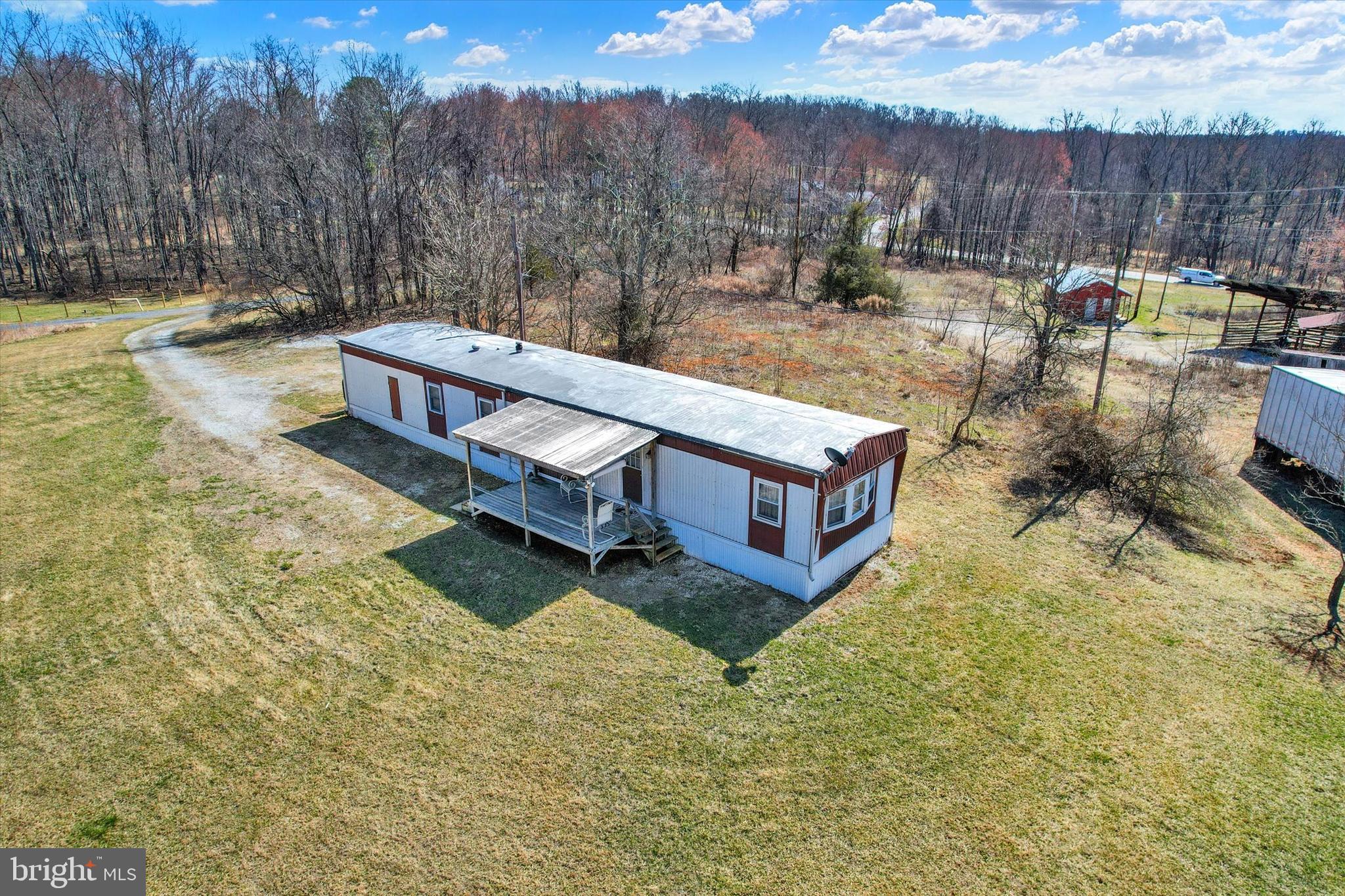 Cozy country living on 6.5 private acres! This 2-bedroom mobile home has a full bath, an eat-in kitchen, and several upgrades throughout. Enjoy the peace and privacy of a rural setting while still being just minutes from Historic Gettysburg, ski resorts, shopping, and major commuter routes. The property also includes a large 24x28 insulated building plus additional outbuildings, giving you plenty of space for storage, hobbies, or projects. A new septic tank was installed, and the strong 150 GPM well is a huge bonus. If you’re looking for room to spread out with convenience nearby, this property is worth a look!