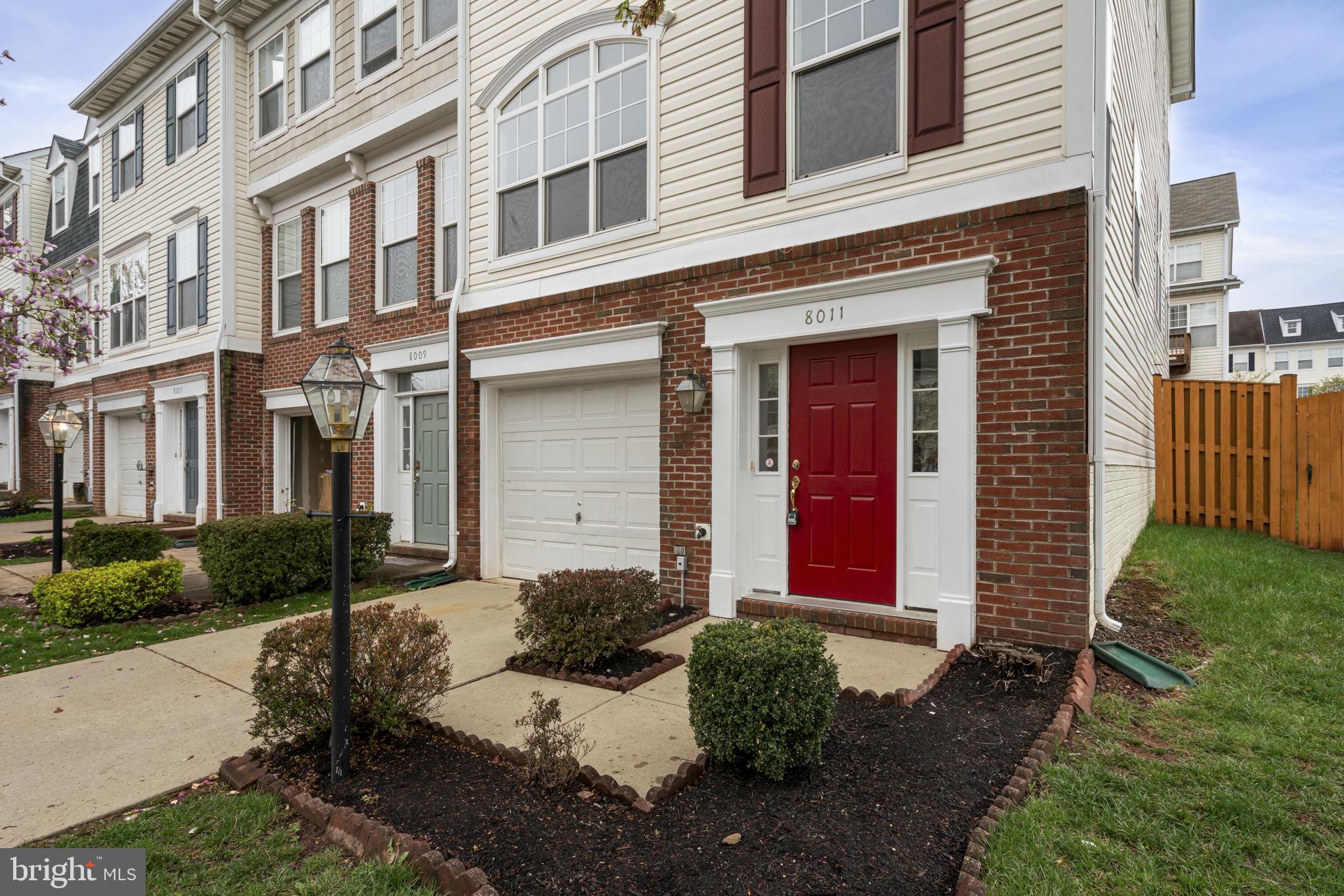Welcome to this stunning charming end unit townhouse, nestled in the highly desired neighborhood of Blooms Mill. This 3-storey townhouse is located in the heart of Manassas. It offers a modern living with an open floor plan that’s perfect for both everyday comfort and special gatherings.

On the main level, you’ll be greeted with a bright tall deep ceiling foyer and gorgeous hardwood floors that flow throughout. The second level is an open-concept designed with a cozy fireplace and a seamless space connecting the kitchen, dining, and living rooms, creating a perfect space for entertaining on beautiful summer days. Just off the kitchen, step outside onto a huge fenced backyard—ideal for outdoor fun and relaxation.

On the third level, you’ll find a spacious primary bedroom suite featuring a ceiling fan, a large walk-in closet, and a luxurious en suite bathroom. The primary bath offers a spa-like experience with dual vanities, a soaking tub, and a separate shower given a luxury feel of a private retreat.  The two additional bedrooms are connected to a hallway full bath offering plenty of space. The lower level provides a flexible space with a spacious room, which can be used as a home office, gym, media room, or even a 4th bedroom.  Additional features include a one-car garage and a driveway to park other cars.  All brand new stainless steel appliances (April 2025), roof replaced, HVAC replaced (2016).

The entire house is fully renovated with fresh paint, new vinyl flooring, new carpet throughout the entire house, house power washed and gutter cleaned. Every corner of the house offers a ton of natural sunlight.

This community offers plenty of amenities. You’ll enjoy access to a pool with a water slide, a basketball court, a clubhouse, and a scenic pond. Nearby shopping, dining, and entertainment options, combined with ideal easy access to commuting routes, makes this beautifully maintained end unit townhouse the perfect place to call home! Don't miss this incredible opportunity to own this gem!