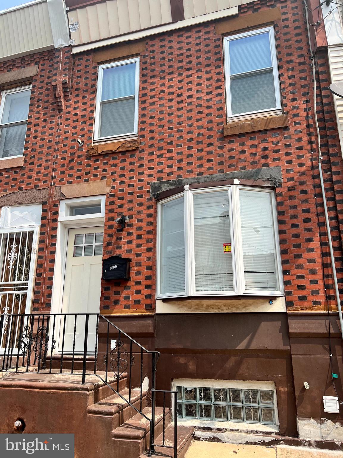 Located in the popular Point Breeze neighborhood, this surprisingly spacious townhome was completely renovated in 2019.  Melding original character with modern amenities, this residence would make a perfect starter home or investment property.  The restored front facade features original, bi-color Philadelphia clay bricks laid in a traditional Flemish bond pattern.  Upon entering, the first things you will notice are the expanse of gleaming hardwood flooring and the original exposed brick wall along the entire left side of the home which provide both character and a sense of luxury.  The southern exposure floods the space with natural light while the open, extended floor plan provides plenty of room for living and dining areas, new half bath, and kitchen on this level.  The star of the show is the enormous, well-appointed dream kitchen featuring copious white cabinetry, SS appliances, expansive quartz counters and gas cooking, perfect for entertaining!  There is also easy access from the kitchen to the large rear yard which provides plenty of space for BBQ, alfresco dining and gardening.  Recessed lighting and a large pantry / coat closet complete this level.  The stairs to the 2nd floor retain the original wrought iron railing mounted on a rough hewn, wooden tread floating staircase with loads of charm.  Upstairs you will find 3 bedrooms and a completely renovated hall bath with tub/shower featuring neutral, yet striking white subway tile.  All bedrooms have ceiling fans and ample closet space.  There is even a large linen closet and extra storage closet in the hallway.  Finally, head down to the partially finished basement with recessed lighting, tile flooring, all newer mechanicals and laundry area.  Use this clean, dry space as extra storage, a play room, an exercise area, office, or workshop.  Easy access to I-76 makes for an easy commute to Center City, the sports complex or NJ.  Move-in ready! Don't miss this one!