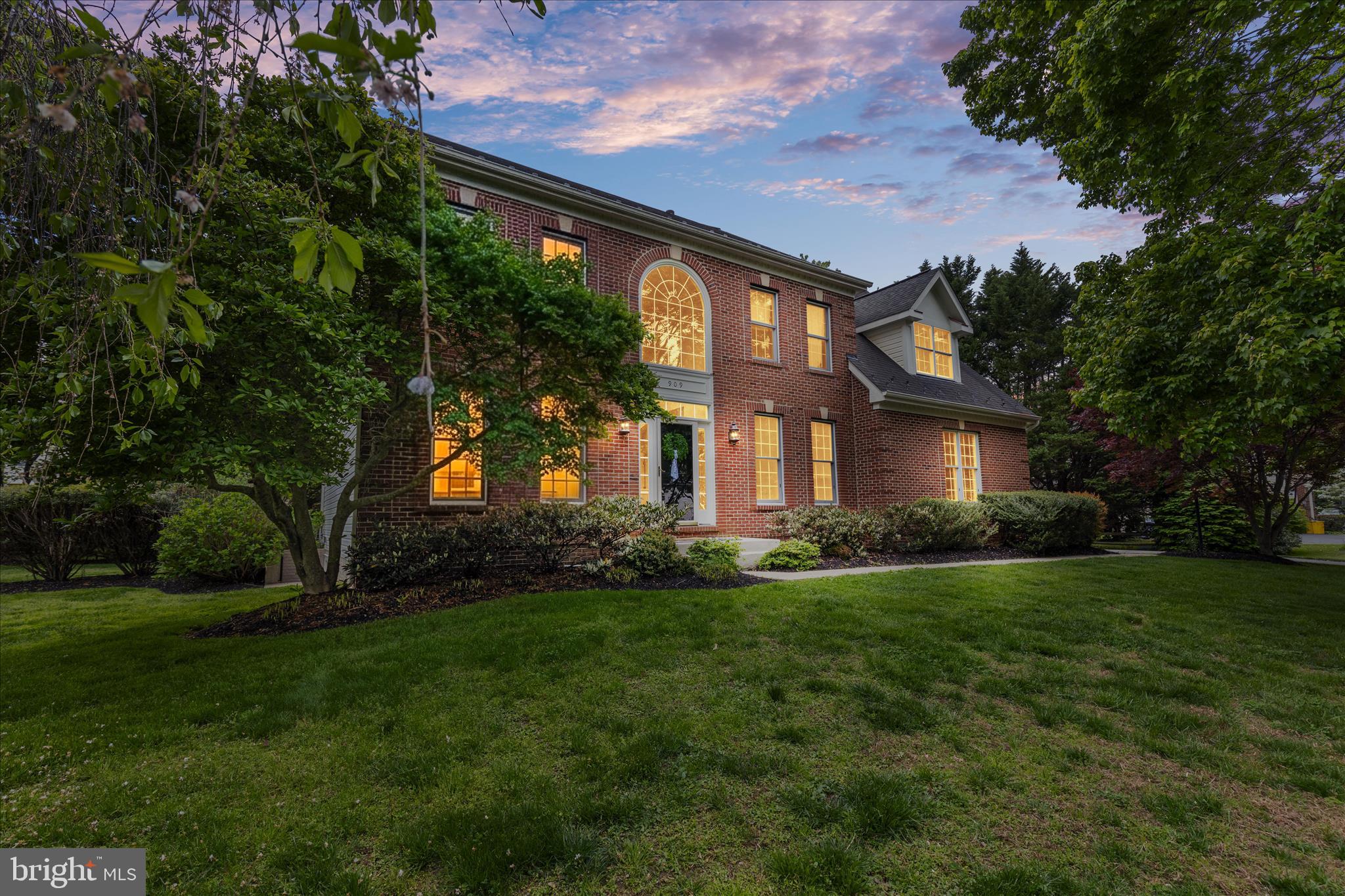 Welcome to 909 White Marlin Way, an elegant brick-front Colonial ideally positioned on a quiet cul-de-sac in the highly sought-after Chesapeake Preserve community on the Broadneck Peninsula. Built in 1999 and set on a beautifully sized .49-acre lot within the desirable Broadneck School District, this meticulously maintained home offers over 4,200 square feet of finished living space, thoughtfully designed for both everyday living and effortless entertaining. Inside, you’ll find 5 bedrooms and 3.5 baths, complemented by a spacious, well-appointed layout. The main level showcases hardwood flooring, a private office with custom built-ins and crown molding, and a warm, inviting family room anchored by a wood-burning brick fireplace with a decorative mantel. The kitchen seamlessly blends function and style, featuring white cabinetry, granite countertops, a contrasting cherry island, stainless steel appliances, a walk-in pantry, and a built-in desk flowing naturally into the heart of the home. Upstairs, the expansive primary suite offers a true retreat, complete with a tray ceiling, two walk-in closets, and a well-appointed en-suite bath with a jetted tub. Brand new carpet (2026) throughout the upper level and stairs adds a fresh, modern touch. The finished lower level provides exceptional flexibility to suit a variety of lifestyles, offering a full bath, wet bar, and versatile spaces ideal for a home theater, gym, or potential sixth bedroom, along with abundant storage and a convenient walk-up exit to the backyard. Outdoor living is equally impressive. A large screened-in porch opens to a beautifully designed paver patio with firepit, perfect for relaxing evenings or hosting gatherings, surrounded by extensive hardscaping and a spacious, usable yard. Additional highlights include a two-car side-load garage, low HOA fees, and numerous updates: new patio and firepit (2024), screened-in porch was rescreened (2025), new carpet (2026), washer and dryer (2024), window screens (2021), large-capacity water heater (2020), and updated kitchen chandelier (2026). Ideally located just minutes from downtown Annapolis, top-rated restaurants, shopping, and major commuter routes to Baltimore, Washington, D.C., and the Eastern Shore. Enjoy convenient access to the new Broadneck walking trail, just a short distance from your front door. This is the perfect blend of space, style, and location, offering the lifestyle today’s buyers are looking for. Contact me to book your tour today.