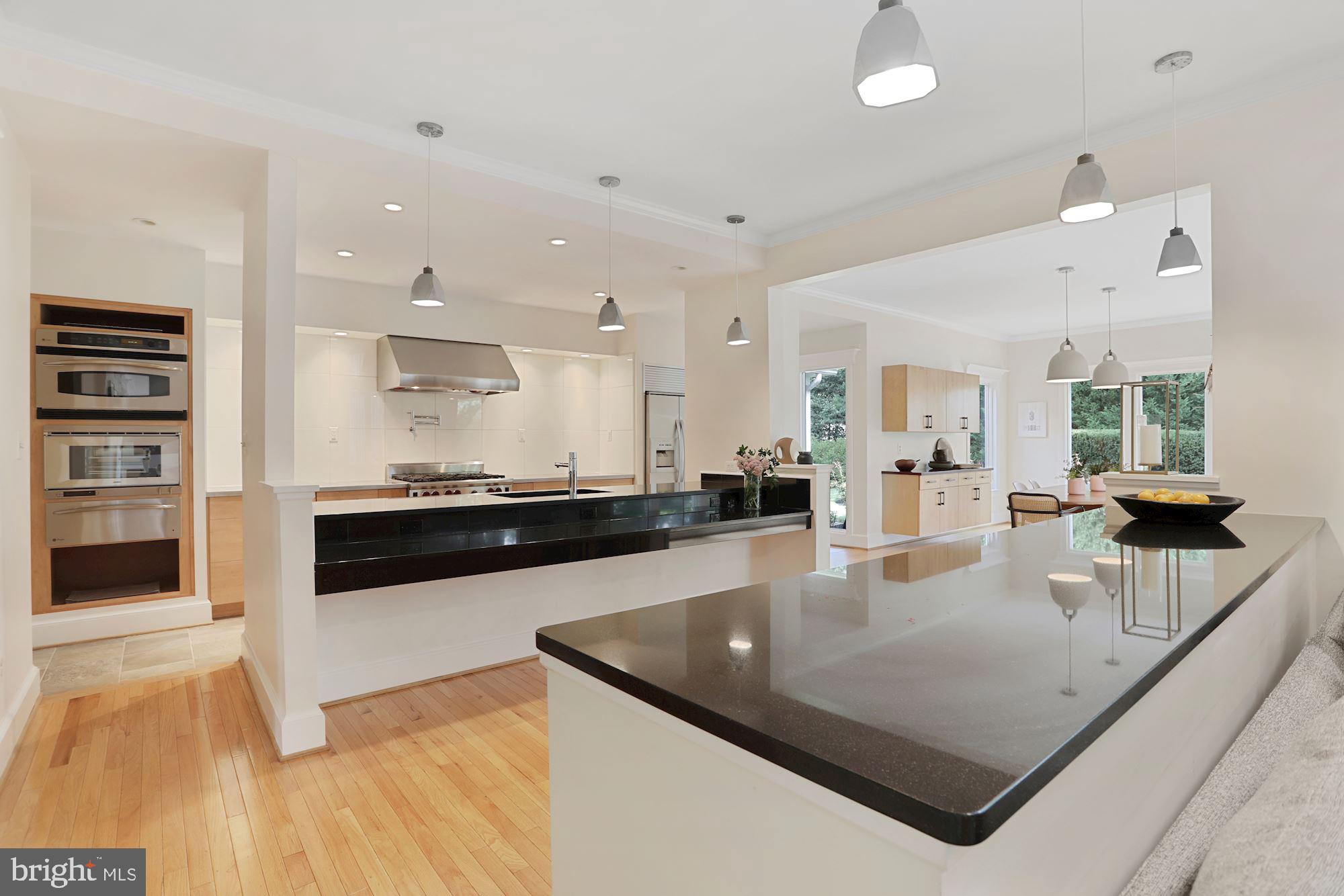Gorgeous updated home with an amazing kitchen and private outdoor setting located in the Langley school pyramid and just 5 minutes from Tysons Corner.  You'll love the updated, modern kitchen and the adjoining, light-filled family room with soaring windows that frame the inviting backyard patio.  The main-level features plenty of areas to gather as well as to work.  The large breakfast room with its expansive windows has enough space for a separate seating area to enjoy your morning coffee.  The oversized mudroom and catering kitchenette are perfect for everyday needs as well as entertaining with its full-size fridge, microwave, dishwasher and abundant counter space.  The office boasts an entire wall of built-in shelves and large windows overlooking the professionally landscaped, fenced-in backyard.  Upstairs you'll find four generously sized bedrooms.  The guest room has a private full bath, and two other rooms share a large jack and jill bathroom with separate private vanities.  Enjoy the cozy, window-lined bonus area in the owners' suite that can serve as a workspace, an infant's nursery, or simply a place to read a good book.  The lower level offers more "hang out" space and features a full bath and large room that potentially could be converted into a 5th bedroom with an addition of a window well.  If you're looking for a move-in-ready home in McLean, this one fits the bill!
