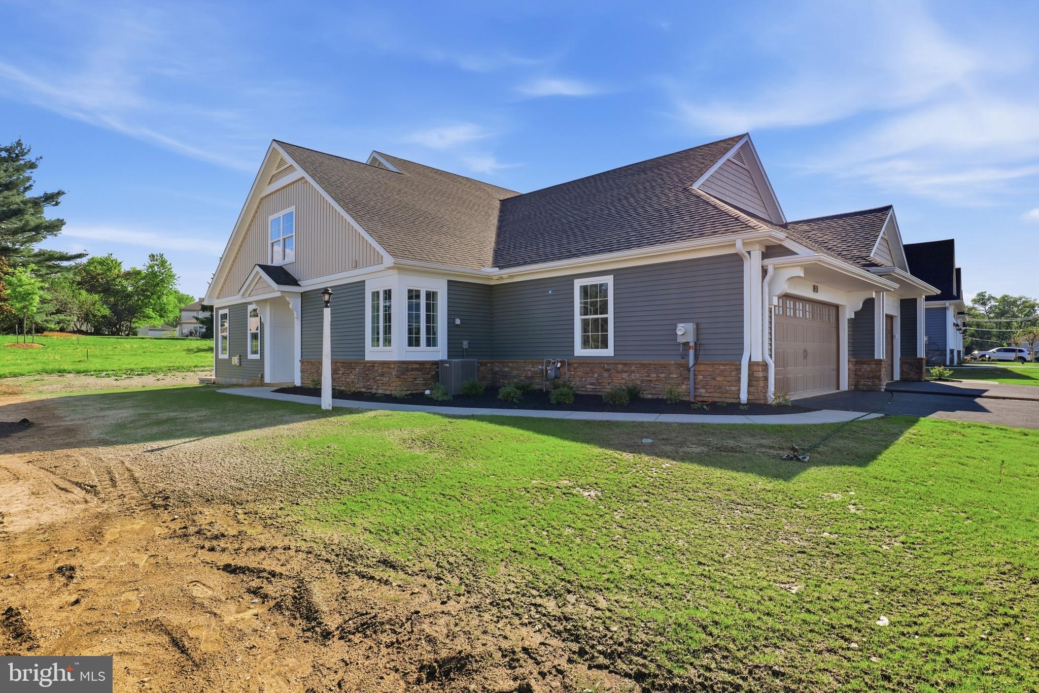 Welcome to exceptional new construction in the sought-after Bellaride section of Crossgates—where thoughtful design, quality craftsmanship, and low-maintenance living come together seamlessly. The Nelson Model is a beautifully appointed 3-bedroom, 2.5-bath home offers over 1,700 square feet of well-designed space with an open floor plan that feels both spacious and inviting, filled with natural light and ideal for everyday living or entertaining.
The main level is designed for ease and comfort, featuring a private first-floor primary suite with a walk-in closet and a luxurious bath showcasing upgraded ceramic tile finishes, a frameless glass shower, and elegant fixtures. The heart of the home is the upgraded kitchen, complete with Wolf Classic cabinetry, stunning Calacatta Bali quartz countertops, custom tile backsplash, and upgraded Café appliances—perfectly blending style and function.
The great room offers a warm and inviting atmosphere with a gas fireplace, stone surround, and custom mantel, while premium Coretec luxury vinyl plank flooring flows throughout the main living areas, adding durability and sophistication. A convenient first-floor laundry room and attached 2-car garage enhance the home’s everyday practicality.
Built with efficiency and peace of mind in mind, this home includes high-performance insulation, a high-efficiency HVAC system, PEX plumbing, passive radon system, and a 10-year builder warranty. Step outside to a rear concrete patio—perfect for relaxing or entertaining in a peaceful setting.
Located in the desirable Crossgates community, residents enjoy a lifestyle close to golf, walking paths, dining, and all that Lancaster County has to offer. Why wait to build when this move-in-ready home already includes the upgrades and finishes today’s buyers desire?