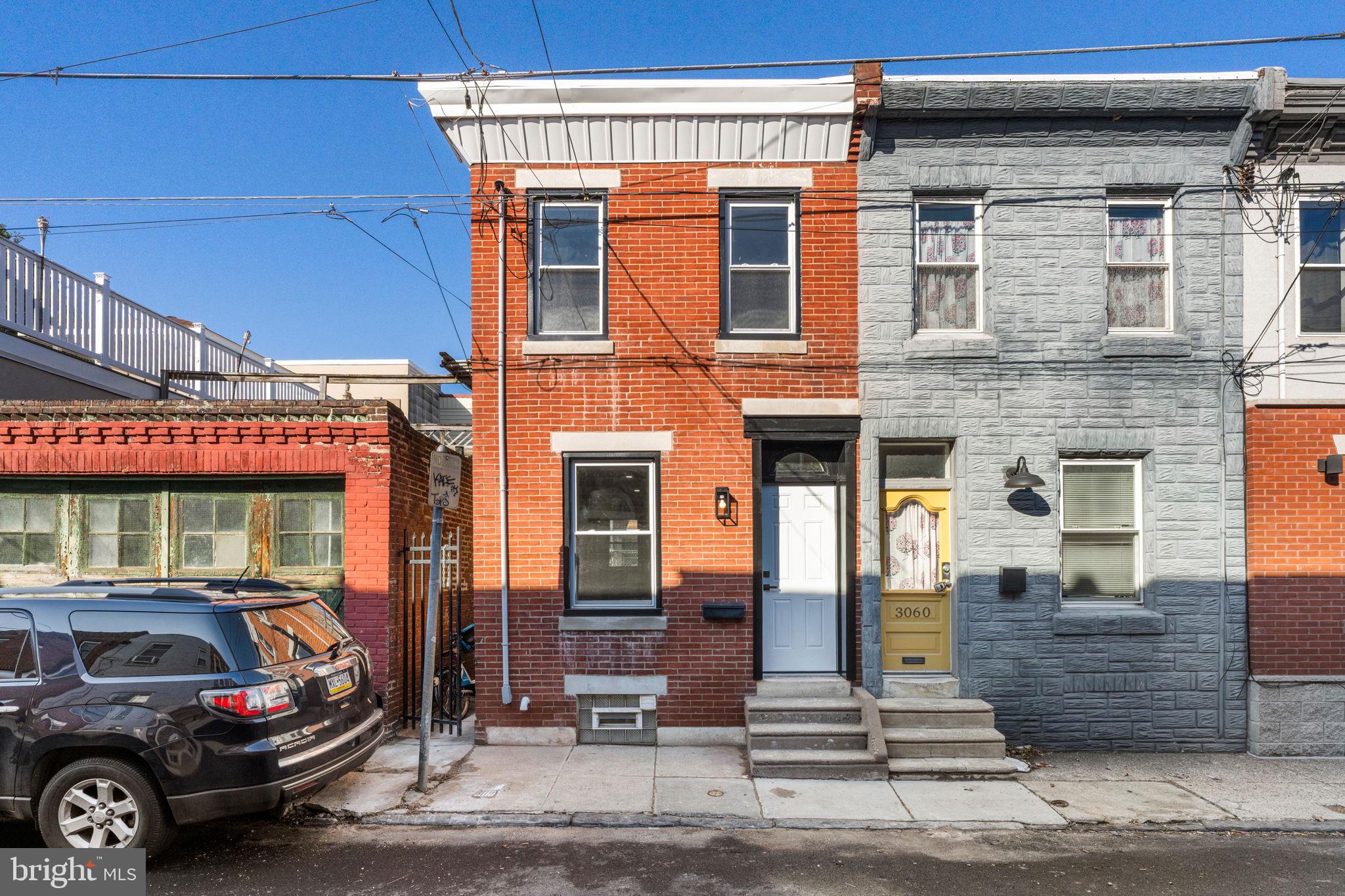 Your new home in prime Port Richmond!
This beautifully renovated 2-bedroom, 1.5-bath rowhome has been lovingly maintained and retains much of its original character, including tall ceilings, and a fabulously retro entryway, seamlessly blended with modern upgrades.
Step inside to a spacious open-concept living with wine refrigerator and dining area featuring wood-plank waterproof laminate flooring, wrought-iron railing, and abundant natural light. The sleek, modern kitchen offers rich wood cabinetry, granite countertops, a ceramic marble tile backsplash, and stainless-steel appliances. A new insulated rear door opens to a poured concrete patio, perfectly squared and ideal for creating the backyard of your dreams.
Upstairs, you’ll find two generously sized bedrooms and a large full bathroom showcasing a tiled stall shower with seamless glass door, heated anti-fog LED mirror with dual lighting modes, new vanity, and an American Standard toilet.  The parged basement provides excellent storage or flexible bonus space.
Located in the heart of Port Richmond, enjoy easy access to popular neighborhood bars, acclaimed restaurants, local shops, and everyday conveniences, as well as quick access to I-95, Center City, Fishtown, and public transportation. This move-in-ready home offers the perfect blend of classic charm, modern comfort, and an unbeatable location.