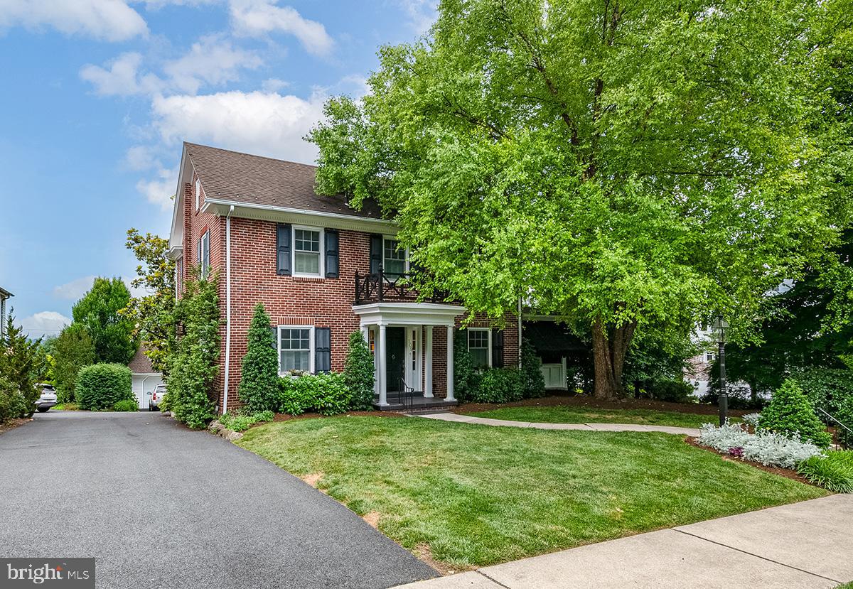 Welcome to 109 E. 36th St, Exeter Township. This classic, two-and-a-half story brick colonial combines stately charm, lush relaxing gardens, and suburban convenience. With four full levels of finished living space (estimated 1923 sq ft above grade, 1007 sq ft below grade), this four bedroom, two and one half bath home is replete with a wide variety of special features and amenities. Your first impression of the interior of the home is the stately brick-floored entry hall with reversing staircase. To the left is the formal living room, to the right the large dining room with fireplace. Beyond the dining room is the relaxing screened porch. To the rear of the dining room is the all seasons sun room. Many of the rooms feature hardwood flooring. Completing the main level is the custom kitchen with cherry cabinetry, built-in appliances, and the adjoining butler's pantry/home office. The second level of the home features the spacious primary bedroom, two secondary bedrooms, a full bath, and access to the second floor deck area with a beautiful view of the lush gardens and Koi pond. The third level includes the fourth bedroom, a half bath, and storage space. To complete the tour of the interior includes a visit to the lower (forth) level of the house. This includes a living room with fireplace, lounge area with wet bar, and full bath, with jetted tub, shower, dressing room, exercise area. This lower level also houses the laundry and utility area. From here, or from the kitchen, or the screened porch, you can access the absolutely stunning wooded glen gardens. This lush space features a large gazebo, alfresco dining area, relaxing fire pit area, and the very special feature, the Koi pond with water falls and stream. Also, in the rear area is the over-sized two-car detached garage. Combine all these amenities with a classic neighborhood, convenient access to everyday community necessities, and easy highway a access and you have an amazing home. Come visit. You will not want to leave!