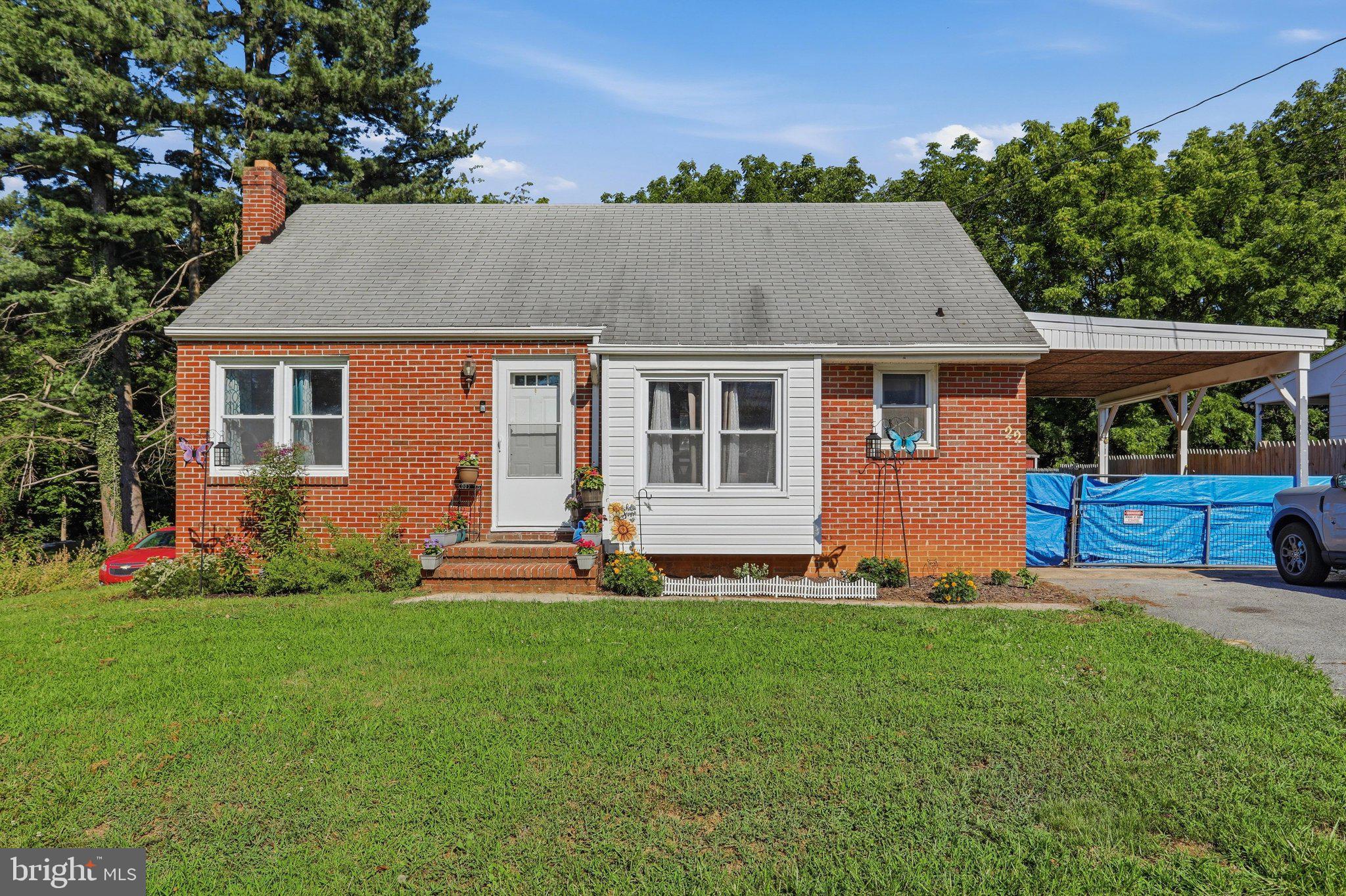 Discover this charming two-bedroom, one-bath brick rancher, gracefully situated on 0.36 acres. This delightful home boasts hardwood floors in the living room and both bedrooms, complemented by vinyl flooring in the kitchen and dining area. Recent updates include new storm windows and storm doors. The expansive backyard comes with a convenient storage shed, while a walk-up attic offers ample storage space, alongside a full unfinished basement. Ideally located near I-70, this property is a must-see for anyone in search of a cozy and practical home!