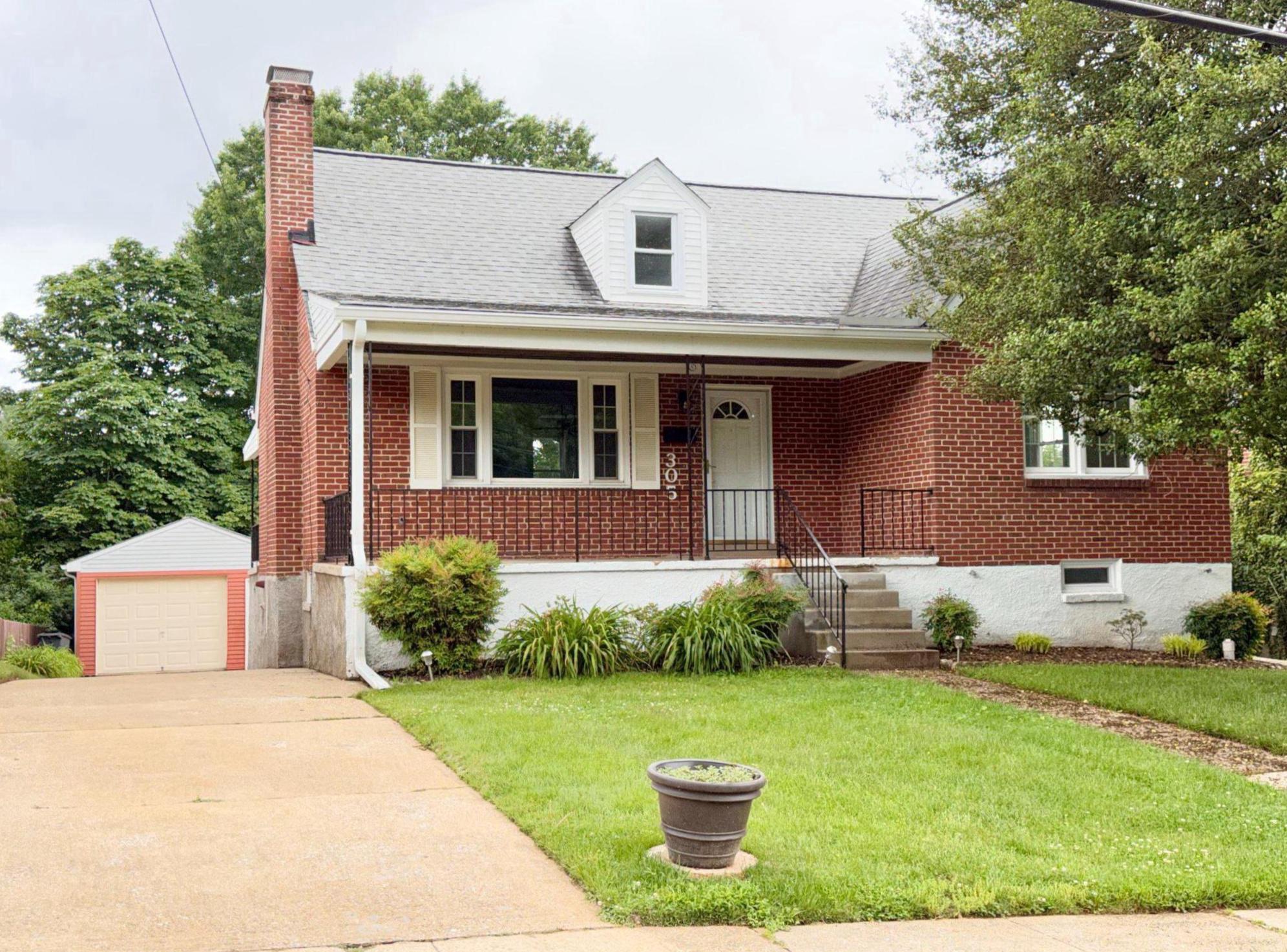 This beautiful brick cape cod holds amazing features from three levels of living spaces, to an oversized one car garage, and a lush yard. The covered front porch welcomes guests to enter a sunlit living room adorned with a fireplace. The path flows into the welcoming dining room overlooking the backyard, dressed with chair rails. The recently renovated galley kitchen boasts plentiful custom cabinetry, quartz countertops, deep undermount sink, white refrigerator and stainless steel appliances, and leads to a covered porch, ready for morning tea and coffee. Two bedrooms and a full bathroom are on the main level. Upstairs, you'll find two bedrooms - one with a flowthrough space ready for your creativity, and a very roomy closet. Entertain in the spacious lower walk out level, complete with a bar, pellet stove, second kitchen area fitted for a gas stove, and full bath. We've prepared for your visit by painting every room, and laying fresh luxury vinyl plank flooring and new carpet. Great location! Great home! Call your agent soon for a showing! Open House Sunday 1-3