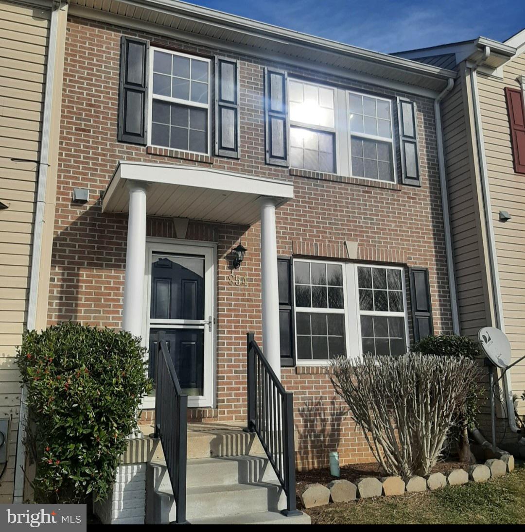 Brick Front interior townhome. All new carpet and freshly painted throughout. All new stainless appliances in the kitchen. Main Level with half bath/large Living Room and Dining Room.  Primary Bedroom with walk in closet, primary bath with separate shower/soaking tub, dual sinks. Second full bath adjacent to two additional bedrooms.  Large full walk-out basement with stairs to rear yard.