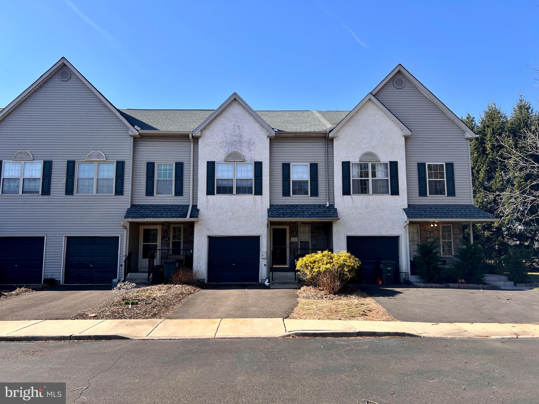 RELO READY / Low association fees... Quick possession OK!  Welcome to this stunning Willowbrook townhouse in Upper Southampton Township, in beautiful Bucks County, PA.  In impeccable condition, this very warm and inviting home boasts spacious rooms throughout with mostly Brazilian Cherry like hardwood flooring on first level with a very well designed first floor plan w/open Living Room/Dining Room areas, Eat-in Kitchen with white timeless refinished cabinetry, new hardware, updated GE stainless steel appliances, sliders to rear deck, having convenient powder room with pedestal sink and updated toilet, and access to front porch, rear deck,  finished lower level basement and built-in garage. The second floor consist of a Primary Main Bedroom with vaulted ceiling and large ceiling fan with remote, display shelf area above wall of closets and bi-fold doors, a Primary Full bathroom suite with Jetted tub, walk-in enclosed tile shower, updated toilet behind privacy half wall, and vanity sink and  tile floor; Second floor hallway has laundry area, full bathroom with tub w/shower and tile  surround and tiled floor, the 2 additional front bedrooms have good size closets w/organizers. A walkup staircase to 3rd level Loft /Office and/or potential 4th bedroom offers plenty more room for everyone. Step outside to enjoy the covered front porch or entertain guests on the rear deck. The built-in one-car garage adds convenience, while the fully finished lower level is perfect for recreation, game day, with dry bar area and walk-in/storage closet, and cozy gas fireplace. Great location in Southampton…  Soccer fields, Community center, Parks, Golf range, Dairy Queen, Coffee shops, & several shopping centers are all a short commute.  Make your appointment today!