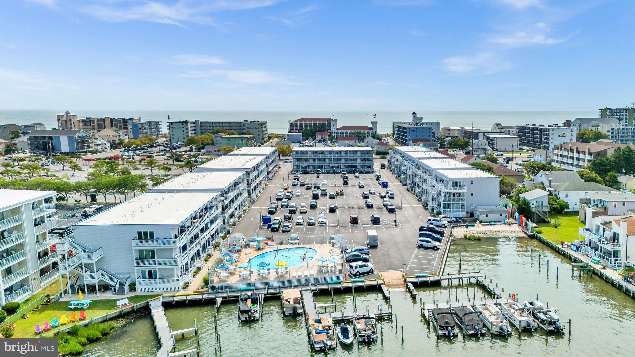 Welcome to your coastal escape in the heart of Ocean City! This beautifully maintained 1-bedroom condo in the sought-after Bradley on the Bay community offers the perfect blend of comfort, convenience, and now—major exterior upgrades that truly elevate the entire building. Recent improvements include a brand-new vinyl railing system, composite decking on the stairs and decks, and a fully wrapped vinyl exterior. These upgrades not only give the building a sleek, modern look but also provide long-term durability and low maintenance. The composite decking resists rot and splintering and eliminates the need for ongoing painting or staining—an incredible benefit for owners. Inside, the condo is fully turnkey and thoughtfully furnished, complete with beach supplies, bedding, and kitchenware—ready for immediate enjoyment. Replacement windows and doors, a Wi-Fi-controlled thermostat, and a one-way privacy storm door add comfort and efficiency. The light-filled living space features an open-concept kitchen and spacious living area, ideal for relaxing or entertaining after a day at the beach. Step onto your spacious balcony to enjoy peaceful bay breezes, or retreat to the generously sized bedroom filled with natural light for a tranquil end to the day. Located just one block from the beach and close to Ocean City’s best dining, shopping, and entertainment, Bradley on the Bay also offers a seasonal outdoor pool, ample parking, and boat slips for water enthusiasts. Best of all—the recent stair tower upgrades are complete with no additional assessments. This isn’t just a condo—it’s your effortless coastal lifestyle.