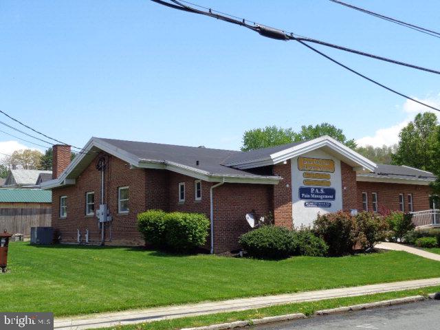 Well built brick medical office that features 7-8 exam rooms, large waiting room and reception area, personal offices, break room, file room, x-ray room, casting room, restrooms and adequate storage areas. Natural Gas Heat and Central Air. Electric Heat pump and electric baseboard in main waiting area. Parking of 22+/- vehicles. Excellent opportunity for dental, chiropractic, medical or business offices. Zoning is Residential but current use is allowed by Special Exception, new owner would need to obtain same from Burnham Borough.,ADA Handicap ramps, emergency lighting, security system