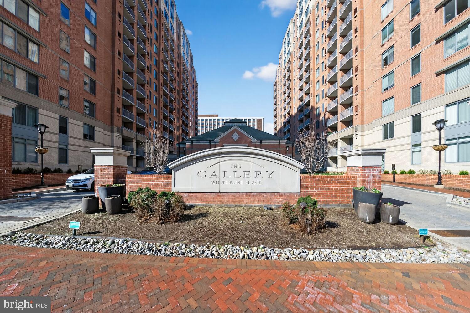 NEW PRICE! Experience elegance, comfort, and convenience at The Gallery at White Flint Place. This luminous, high-floor one-bedroom, one-bath residence is situated merely one block from the vibrant Pike & Rose district, providing unparalleled access to an array of dining, shopping, and entertainment options. The North Bethesda Metro (red line) is next door, and a convenience store and Wegmen's are all within a short distance, facilitating a car-free lifestyle with ease.

Upon entering, one is greeted by a sun-filled and newly upgraded interior featuring pristine luxury vinyl plank flooring. The thoughtfully remodeled kitchen boasts high-end quartz countertops, a custom-built breakfast bar,  as well as brand new stainless steel appliances. Glass sliding door leads to private balcony revealing panoramic treetop and cityscape views. The spacious bedroom with custom walk-in closet serves as a tranquil retreat, and the inclusion of in-unit laundry and 1 car garage parking adds to the everyday convenience.

The Gallery offers resort-style amenities, including a 24/7 concierge service, a fitness center, a swimming pool, social lounges, a billiards room, and beautifully landscaped courtyards. All of this is located just steps away from the finest offerings of Pike & Rose and one block from the Metro, allowing residents to truly live, work, and play in style. Additionally, easy access to major highways I-270 and I-495, along with public transportation conveniently located nearby, ensures a simple and convenient commute to Washington, D.C., and Virginia.
OPEN HOUSE / HAPPY HOUR TOUR Thur. 3/19/2026 5:30PM to 7:30PM