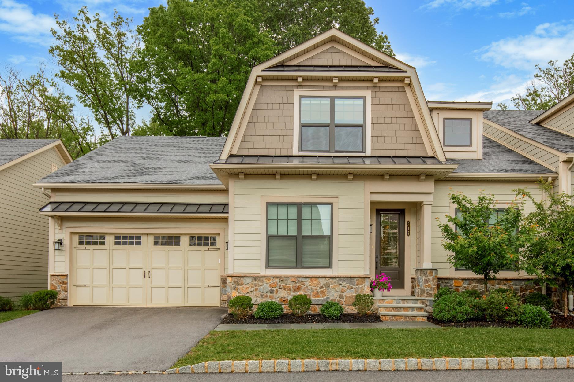 " Welcome to Wayne Glen by NV Homes.  Don't miss the opportunity to live in the only new luxury community in Wayne with a Low Maintenance lifestyle. The Bryn Mawr home is designed to offer you the convenience of a first-floor living plan. Upon your entry, the foyer opens to an elegant dining room on the left and to the right to a large guest bedroom with a full size bathroom, with beautiful windows with tons of natural light.  Just beyond you will find a formal study/office with beautiful French doors and transom. An enormous great room, dining area, and a large gourmet kitchen makes this home a fantastic place for entertaining with family and friends.  You will also love the other luxury upgrades, like hardwood floors, and extra cabinetry with Hutch!  The added morning room allows more space for entertaining or just to enjoy a cup of coffee or tea and your favorite book. A nice size added deck enhances the outdoor living experience.
The owner's suite is set apart but with the convenience to be on the main floor and features a spa-like owner's bath with double shower heads systems, dual vanities, upgraded walk-in closets as well as lots of closet space. Adding a luxurious look, the owner's bedroom also includes a tray ceiling. The laundry room is conveniently located just off of the two-car garage, just a few steps from the owner's bedroom. On the second floor there is a full bedroom a great size den and a full bathroom, plus another room that can be used as a study or office. The amazing finished lower level/basement is currently used as an oversize family room, with a full bathroom.  This lower level includes a lot more space that can be finished as an additional bedroom and or an extra storage area or gym. 
This home offers well-appointed exterior details including Hardy plank siding, natural stone,  bluestone walkways, and lots of green spaces along the community. This is a place where comfort, functionality, and entertaining converge seamlessly, offering the award winning Tredyffrin/Easttown School District, close proximity to shops, restaurants, and places of worship, the King of Prussia Mall,  and easy access to main expressways.  This home is truly a Wayne gem!