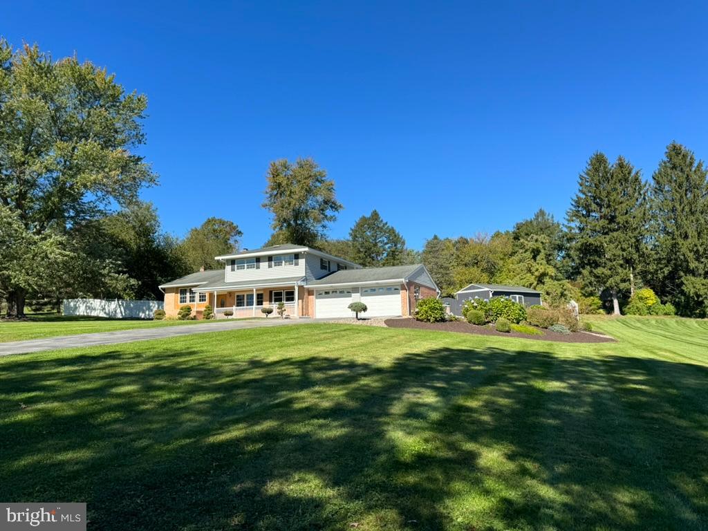 Very rare (first time listed), stunning estate property located in Orwigsburg Borough. Excellent location, walkable to both country club golf course and in-town shopping. 330 Eisenhower Drive sits commandingly atop its premium 1.3 acre lot complete with mature trees, meticulous landscaping, and isolated privacy. The massive, completely fenced rear yard boasts a breathtaking in-ground pool, extensive greenery, oversized storage building, exterior floodlights, and a new, massive TREX deck (with pergola and built-in bench seating) that will leave your jaw on the floor. This property can be both your private, personal oasis as well as a legendary place to host friends and family. 

This 3 bedroom / 2.5 bathroom home has been completely redone with some dazzling touches. Upon entry, past the tiled foyer, beautiful oak hardwood floor and stairs have been expertly restored. The huge eat-in kitchen/dining area has been completely done in premium porcelain tile flooring. New kitchen cabinets, pantry, kitchen island, dishwasher, stainless steel range hood, gloss-white subway tile backsplash, plumbed-in pot filler, and superb, brand new premium granite countertops.

Spacious family room boasts great natural light, gas fireplace, exposed brick with tons of character, and new hickory wood floor that inspires a bright and airy feeling. Adjoining this room is a study/office with its own private bathroom and access to the pool/recreation area. This could also easily be a 4th bedroom.

Upstairs, three spacious bedrooms have all been freshly carpeted and enjoy very pretty views of the property and surrounding countryside. There is a large, full bathroom on this level with tub-shower and double sink vanity.  The primary bedroom enjoys an additional, en suite full bathroom lavishly tiled floor-to-ceiling!

The home has central air conditioning, new oil hot-water radiant heat, new electric hot-water heater, as well as a brand new 200 amp electric service. Two-car oversized attached garage with interior access for convenience. Pool has brand-new filtration + circulation system.

Stately yet fresh and modern, opportunities like 330 Eisenhower are few and far between. Do not miss out. Showings now available.