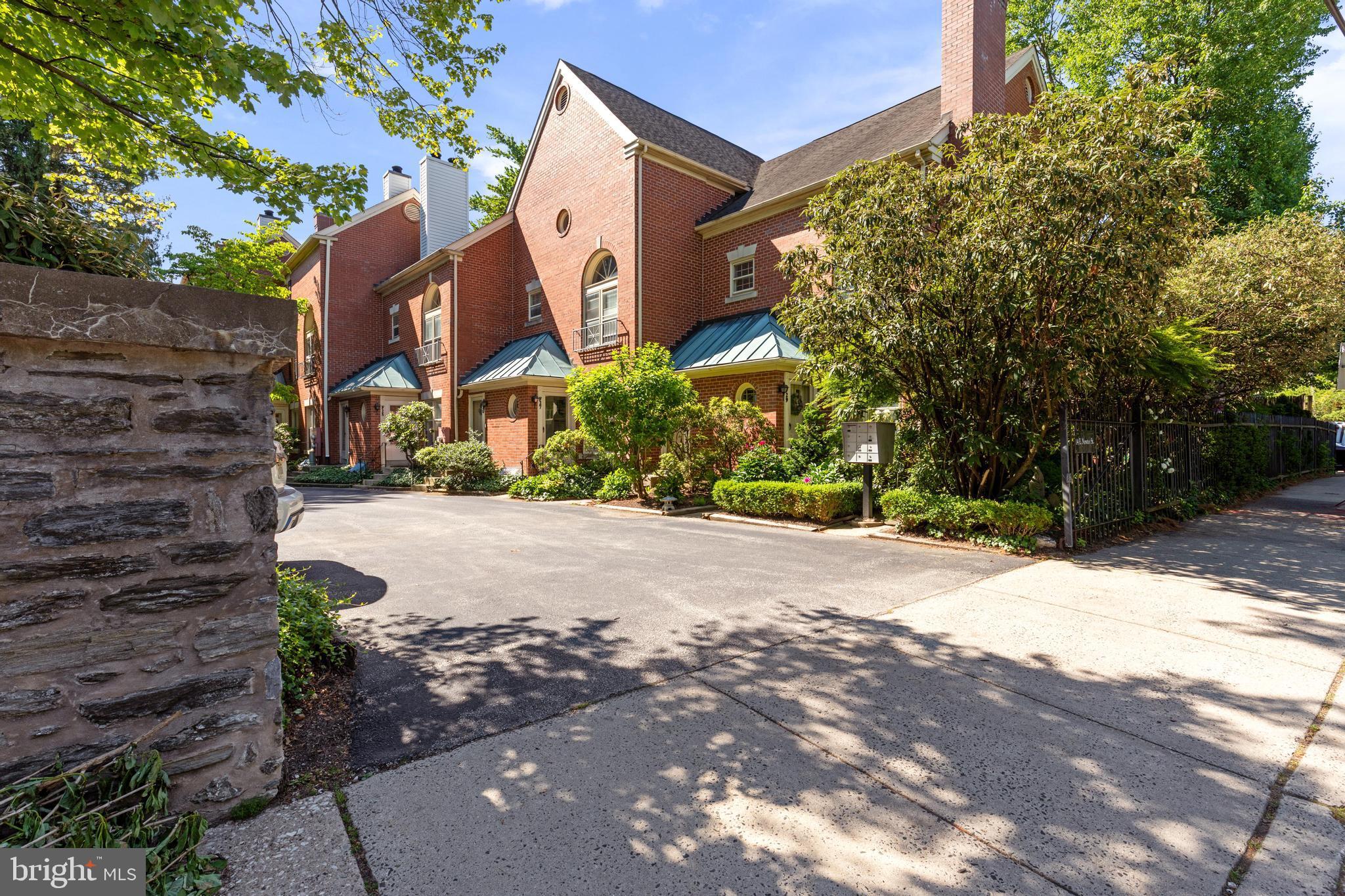 This beautiful updated property is just a short walk away from all of the shops and restaurants that Chestnut Hill is famous for.  Entering the first level, you will find a sunlit filled living room with a wood burning fireplace, a dining area and an updated galley kitchen.   Nearby there is a bedroom overlooking a flagstone patio and garden and also a recently renovated full bath.  The spacious and finished lower level offers a full bath, laundry, and additional space for a study or nursery. There is central air, hardwood floors, a dedicated parking spot, and a low HOA fee that includes water, exterior maintenance, snow removal and more.  This is the only Tavistock unit in this area with two full baths. Some recent upgrades are a new electric panel, gutted and rebuilt first floor bath with Kohler fixtures and marble shower floor, new water heater, new paint, and new ceiling fixtures in kitchen and living area.  The Chestnut Hill East line is just steps away, and the beautiful Wissahickon Valley of Fairmount park is nearby.  Make an appointment to see this special home today! Note: Total finished square footage is 1,409 sq ft