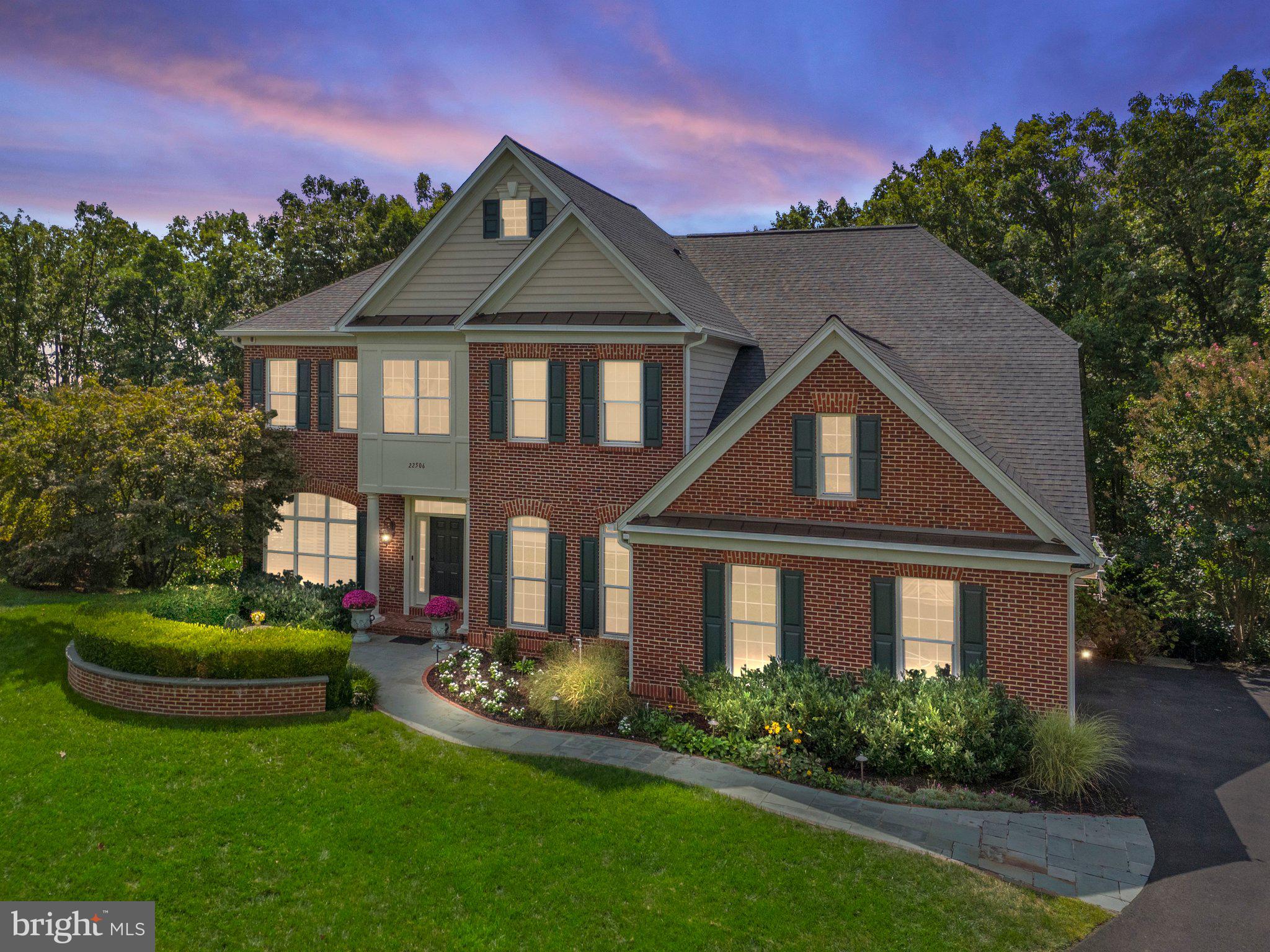 Welcome to 22506 Pine Top Ct! This breathtaking estate home is nestled in the prestigious Estates of Forest Ridge in Ashburn, VA. Boasting five spacious bedrooms, four full bathrooms, and one half-bath, this meticulously maintained residence offers 5,996 square feet of finished living space. Perfectly tucked away on a private cul-de-sac, the property backs to 4.5 acres of serene, HOA-protected woods, providing unparalleled privacy and a picturesque natural backdrop.

Step into the grand foyer, where two-story ceilings and a sweeping curved staircase with wrought iron spindles set the tone for elegance. The main level features formal living and dining rooms, a cozy family room with a gas fireplace, a gourmet kitchen outfitted with stainless steel appliances, granite countertops, a large island, and a sunny eat-in dining area. From the kitchen, enter onto a large composite deck with a modern cable railing system that enhances the unobstructed views of your private backyard oasis. 
Completing the main level are an elegant office and a conveniently located half-bathroom. 

On the upper level, the second-floor foyer overlooks the grand foyer / entrance and family room, offering a sense of openness and elegance. The luxurious owner’s suite is a true retreat, complete with a coffee and wet bar station, an ensuite bathroom, a spacious walk-in closet, and tray ceilings. Three additional bedrooms provide ample space for family and guests, with one featuring its own private bathroom and two connected by a Jack-and-Jill bath. A laundry room completes the upper level for added convenience.

The renovated lower level is an entertainer’s paradise. Highlights include a well-appointed sitting area, a custom bar, a stunning second fireplace with a wall-mounted television, a home gym, and an additional bedroom with a full bathroom along with a large utility room, workshop, and storage area with shelving to provide ample storage space. Need more Outdoor Living Space, you will surely enjoy the large lower level fully covered paver patio with access to the uncovered patio area with beautiful railing and cable wiring system, that leads to the standalone hot tub and to the private flat back yard that is surrounded by nature and trees for enhanced privacy.

This home is filled with premium upgrades that elevate its appeal and functionality. A new roof was installed in 2024, ensuring durability and peace of mind. Thoughtfully designed structural enhancements expand the living space, adding generous square footage to the dining room, upper-level bedrooms, and main-level office. Outdoor features include a relaxing hot tub, a lawn irrigation system, invisible fencing, extensive outdoor lighting, and meticulously designed hardscaping and landscaping. Inside, the home boasts Restoration Hardware chandeliers, elegant crown molding, recessed lighting, and a convenient chandelier lift system in the family room, Lutron home automation switches, premium thermostats, and built-in audio speakers that enhance the ambiance in the main living areas, deck, and patio. Every detail has been carefully curated to offer both luxury and convenience.

Convenience is unmatched with nearby shopping, dining, entertainment, and recreational facilities. The property offers easy access to major roadways for commuting to Northern Virginia, Washington, D.C., and Maryland. Public transportation options include the Silver Line Metro just 5.7 miles away, while Dulles International Airport is a mere 7.1 miles from your doorstep.

Do not miss the opportunity to make this stunning property your new home. Contact your Realtor to schedule a private tour today!
