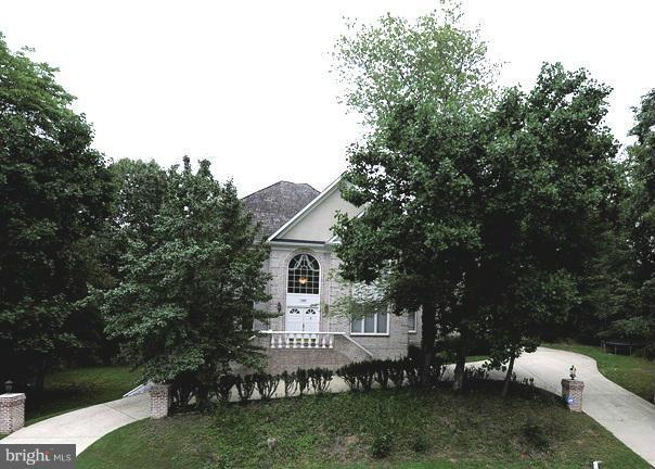 Embassy style home perfect for entertaining. Marble two story foyer & stately columns separating the LR & DR, large kit. open to family room, separate library, walk-out LL with Rec Room, wet bar area, bedroom, bath & additional storage area. The master suite has whirlpool tub, separate shower & water closet. Over 7700sqft od finished space close to public transportation.