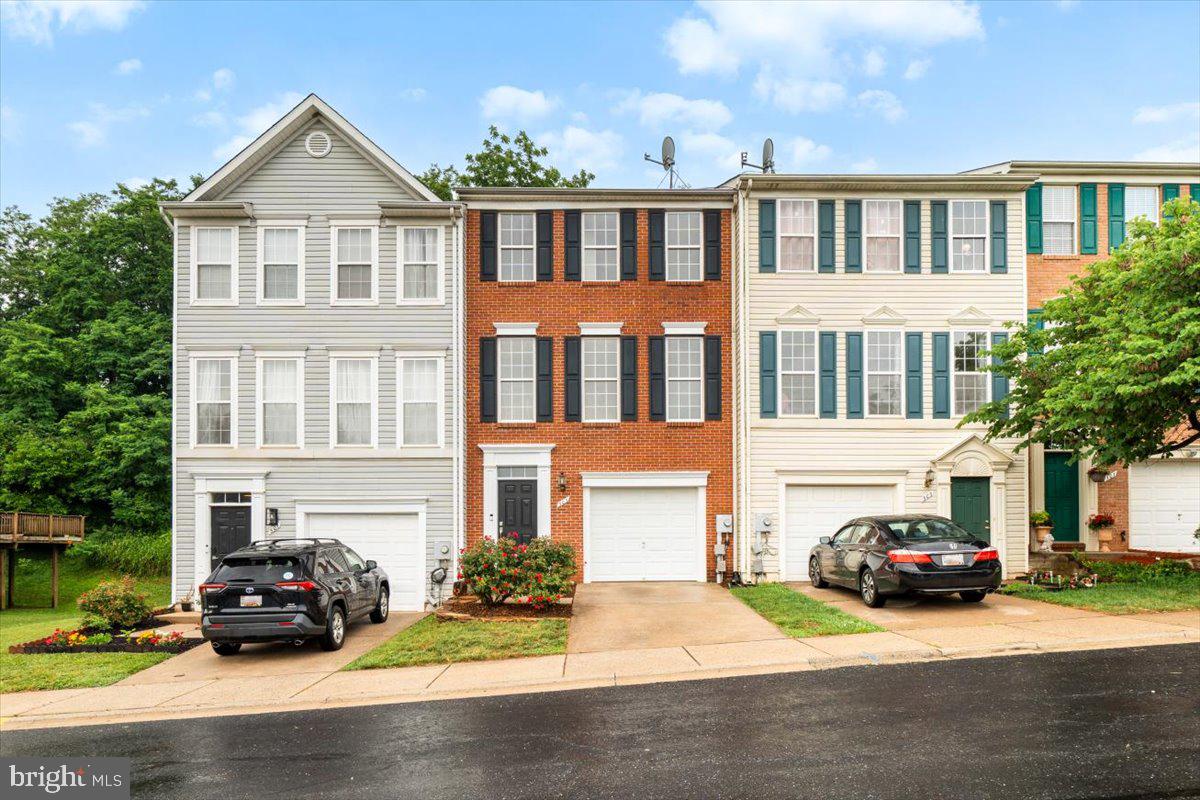 Welcome home to this beautifully updated brick-front townhouse in Frederick, ideally located close to commuter routes, shopping, dining, and everyday conveniences. Enjoy the added benefit of backing to trees and being adjacent to Overlook Park, offering scenic walking trails right outside your door.

This spacious 3-bedroom, 2 full and 1 half bath home features soaring ceilings, abundant natural light, and thoughtful updates throughout. The main level offers an inviting open feel with hard-wired speakers throughout the home, added recessed and accent lighting, and access to the private rear deck. The kitchen is designed for both everyday living and entertaining with granite countertops, new appliances, a large pantry, and a dedicated eat-in space.

Recent improvements include new flooring and paint throughout, a new washer and dryer, updated lighting, and ceiling fan pre-wiring in the family room and bedrooms. The spacious primary suite includes a large walk-in closet and a beautifully updated ensuite bath with new tile and a relaxing jacuzzi tub.

The fully finished walkout basement provides even more living space with a large recreation area, half bath, garage access, and walkout access beneath the deck to the backyard. Additional features include a front-loading one-car garage, private driveway, and extra community parking nearby.

With modern updates, functional spaces, and a prime location next to nature trails while still offering easy access for commuters, this move-in ready home offers the perfect blend of comfort and convenience!