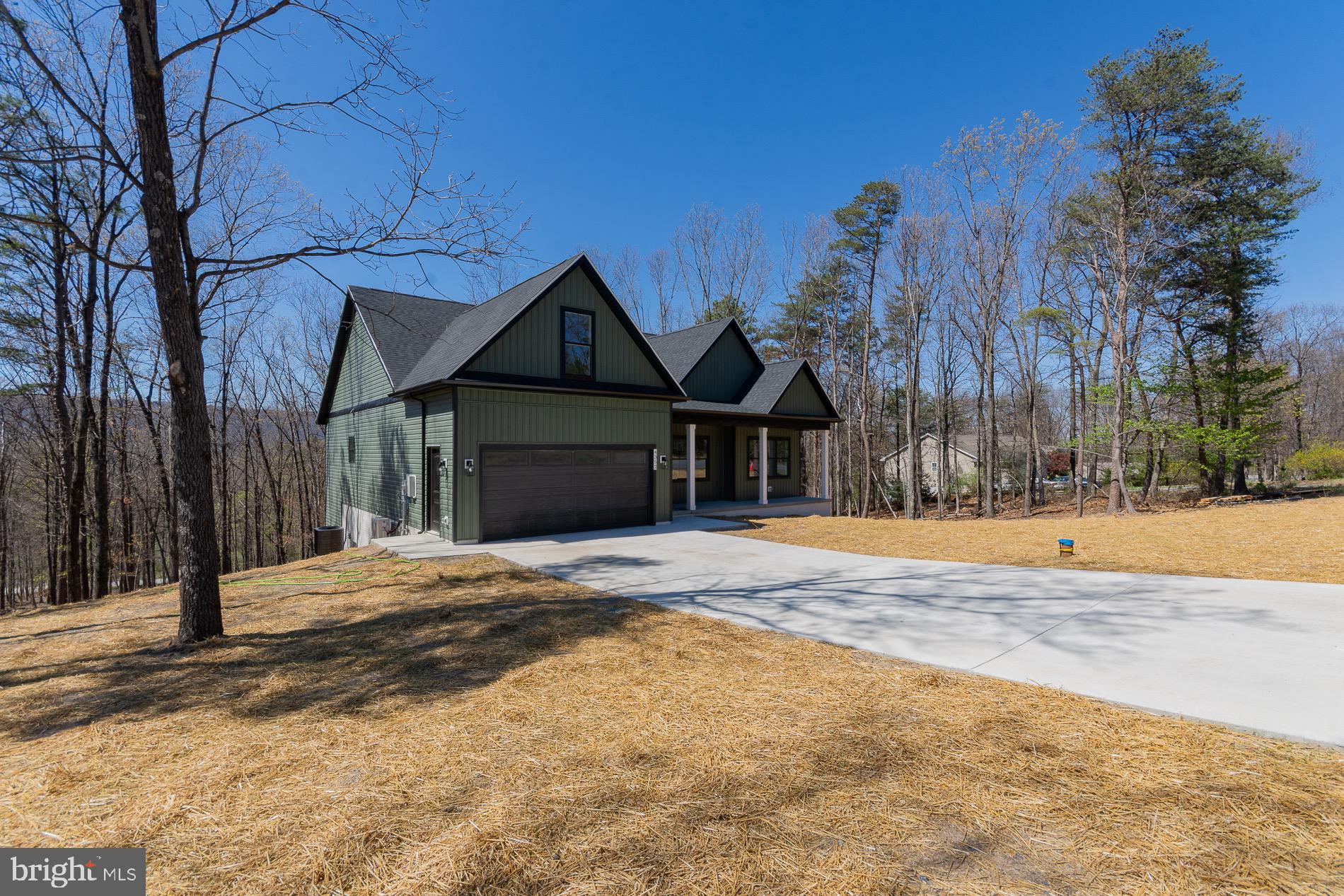 This is the home you’ll fall in love with—no question. This stunning four-bedroom, two-bath rancher offers well over 2,000 square feet of beautifully designed living space, including a spacious bonus room over the garage. Perched above a scenic two-acre lot, the home enjoys peaceful views while being just minutes from Route 522, with easy access to both Winchester and Berkeley Springs.

Inside, soaring cathedral ceilings and an open, thoughtfully designed layout create an immediate wow factor. Downstairs, a massive unfinished basement offers incredible potential, allowing you to expand to more than 3,400 finished square feet if desired. Even better, the builder is happy to complete the space to suit your vision.

The builder will be building installing a 14' x 20' two level deck on the back.

This is a rare opportunity to enjoy the serenity of country living without sacrificing convenience—private, picturesque, and perfectly located.