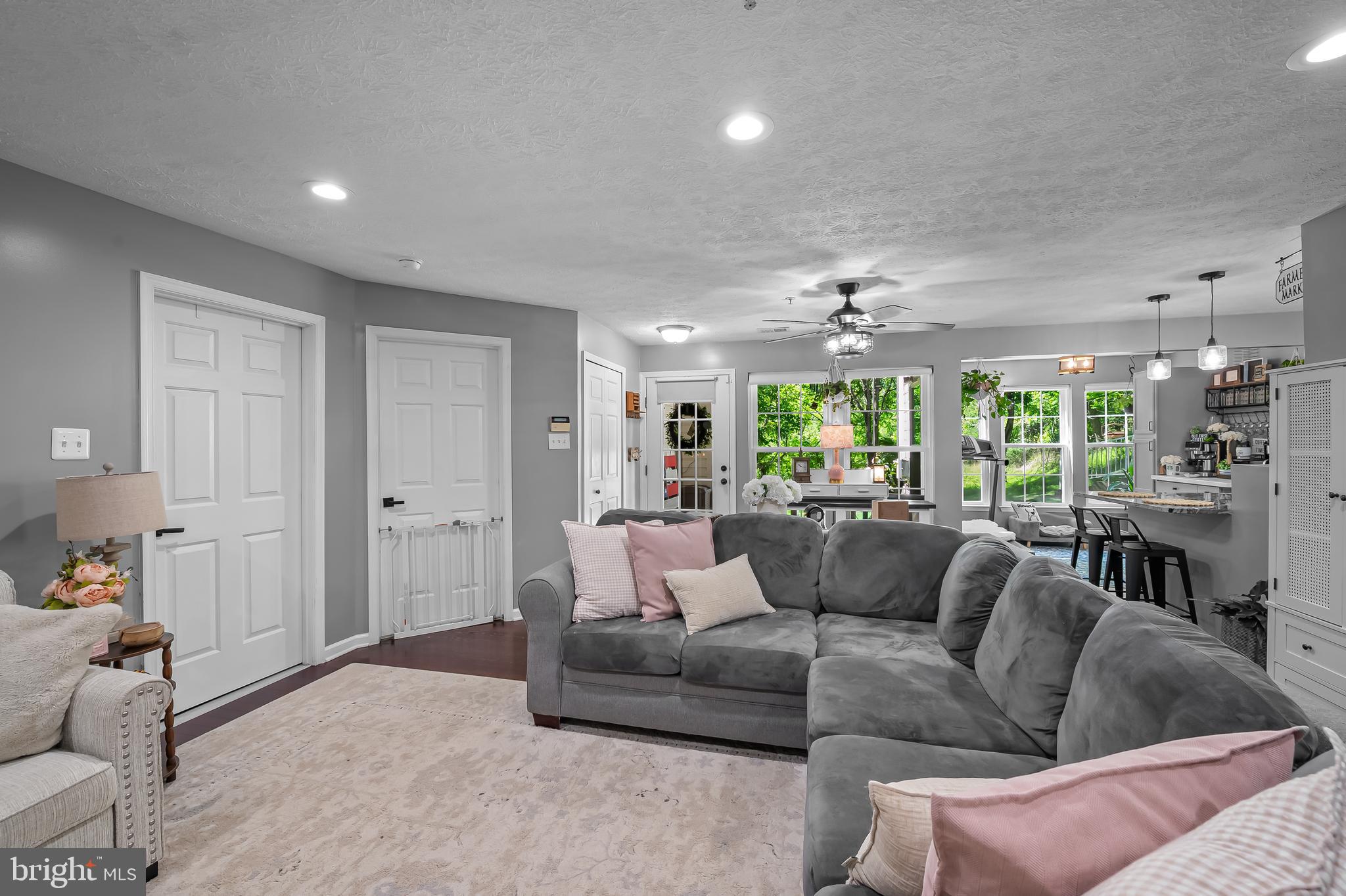 Renovated, move-in ready! Tucked away against a protected wooded backdrop, this beautifully updated 2-bedroom, 2-bath condo offers the perfect blend of privacy, comfort, light, and convenience in Owings Mills. Enjoy peaceful views year-round from your private retreat while being just minutes from shopping, dining, commuter routes, and everyday amenities. The first floor condo has been thoughtfully improved over the years with a renovated primary bath (2018), updated guest bath (2019), and stylish kitchen renovation with stainless steel appliances and granite countertops (2021). Major systems have been updated as well, including HVAC (2022),  windows (2024), washer and dryer (2024), dishwasher (2026), bedroom carpeting (2026), and roof (2025). Recent enhancements include recessed lighting, bar lighting, and a ceiling fan in the office, all added in 2025, creating bright and functional living spaces throughout. Carpet to be added to primary bedroom.  Private first floor entry at the back of the building.  Ample parking is available for residents and guests.  Water, sewer, trash removal and snow removal are all included in the condo fee. Amenities include three pools, playground, a dog run, and tennis courts.