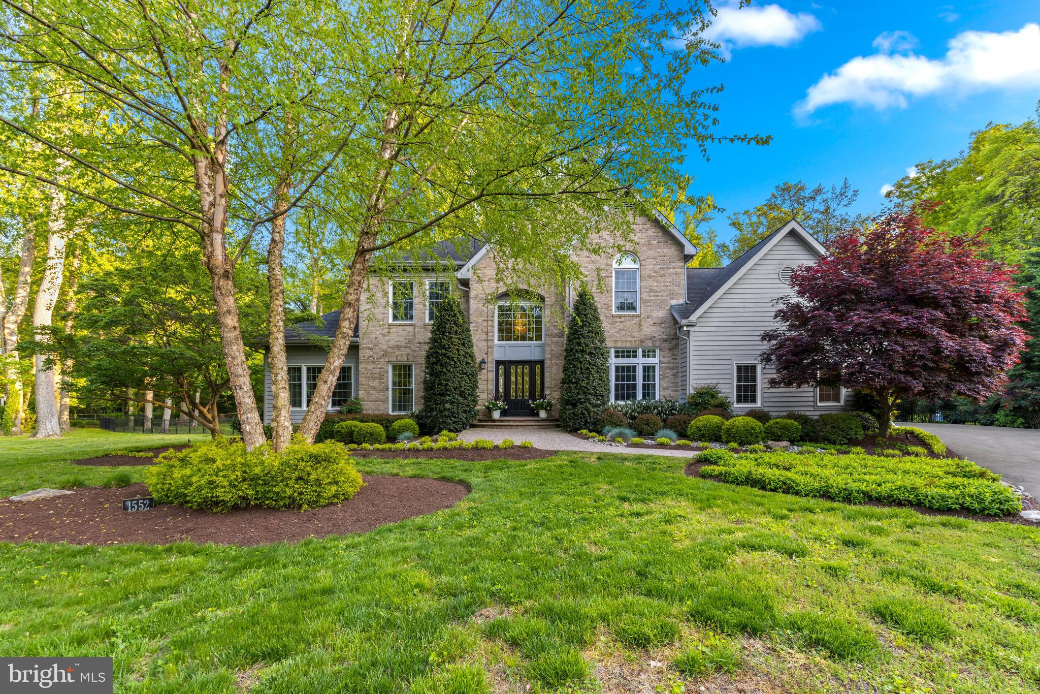 Welcome to your dream home in the exclusive community of Chesapeake Oaks, nestled within the highly coveted Broadneck Peninsula. Prepare to be enchanted by this luxurious 5 bed, 4.5 bath approx. 6,000 sq ft custom-built residence, boasting unmatched craftsmanship exquisite design at every turn. This home offers an unparalleled lifestyle of sophistication and comfort. Upon entering, you'll be greeted by a 2-story foyer and staircase, setting the stage for the elegance that awaits. The main floor design features a sophisticated home office with a wall of windows, seamlessly connected to a formal den by a stunning double-sided gas fireplace. Entertain in style in the formal dining room, adorned with custom built-in cabinets and elegant crown and picture frame molding, all complemented by gleaming hardwood floors throughout. Retreat to the spacious primary bedroom suite, complete with a beautifully updated ensuite bath featuring a steam shower, jacuzzi tub, and a large walk-in closet with built-in organizers. French doors lead to your private backyard oasis, where you can relax and unwind in tranquility. The heart of the home lies in the 2-story great room, anchored by a striking stone gas fireplace and custom-built cabinets, flowing seamlessly into the gourmet eat-in kitchen. Here, culinary enthusiasts will delight in the expansive island, light gray soft-close custom cabinetry, quartz countertops, designer backsplash, exquisite pendant lighting, and high-end stainless-steel appliances. A walk-in pantry and custom-built dinette area add to the allure, with windows offering picturesque views of the lush 1-acre private lot. Architectural details abound, including cathedral ceilings, 9 ft. ceilings, interior arch doorways, and transoms, while recessed LED lighting and skylights illuminate the home with natural light. Step outside to your own private retreat, where a heated, saltwater pool awaits, surrounded by a beautifully manicured yard. A gazebo wired for a hot tub, a large Trex deck with a remote retractable awning, and a built-in seating area with a propane fire pit offer endless opportunities for outdoor enjoyment. The upper level of the home offers a 2nd owners suite with attached full bath and 2 additional beds and full bath. The basement level of the home extends the living space with an additional 2,000 sq. ft. offering a home gym, 5th bedroom with attached full bath and sauna, spacious entertainment area featuring a wet bar. Storage needs are met with an ample 238 sq. ft. of unfinished space and convenient Bilco basement doors providing backyard access. A MAJOR RENO in 2019 transformed the residence, updating the Kitchen, leveling the sunken living room, relocating the gas fireplace, and adding architectural windows and French doors for seamless indoor-outdoor flow, with the stone gas fireplace becoming the focal point of the great room. These enhancements created a cohesive open concept living space, perfect for modern lifestyles.  SELLER UPDATES: architectural windows/doors $50K - (2020), pool equipment & resurfacing $19K - (2021), LED lighting (2019), roof $25K - (2019), attic insulation (2023), garage doors (2022), epoxy garage flooring (2022), well replacement (2009), tankless water heater & constant pressure well pump (2014). Additionally, the property boasts 4 (owned) propane tanks used for heating the pool, fueling the generator, and powering both gas fireplaces. Completing the picture is an oversized 2-car garage with ample storage. There are (2) private community areas on the Bay side for residents to use for socializing/swimming. Located in the sought-after Broadneck School district and close to Downtown Annapolis, Podickory Point Yacht & Beach Club, Sandy Point State Park, and major commuting routes, this is more than a home—it's a lifestyle. Don't miss your chance to experience the epitome of luxury living in Chesapeake Oaks. Call the Listing agent for your private tour today!