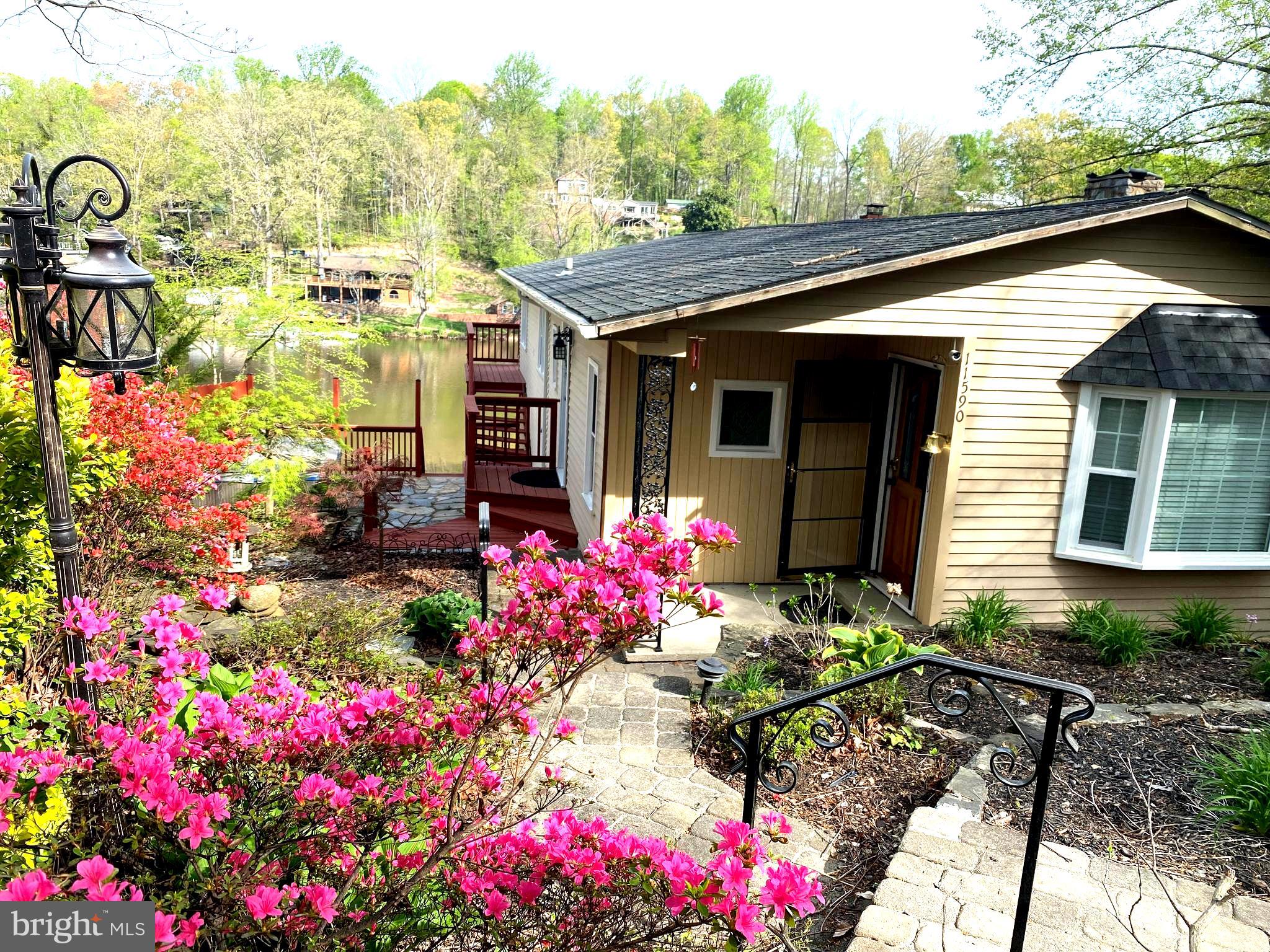 WATERFRONT! UPDATED! BEAUTIFUL! Escape to this Gorgeous, Renovated home on the highly sought-after Lake Jackson—a perfect retreat for those seeking tranquility with family and friends. Enjoy water activities from your private dock, including fishing, kayaking, and outdoor grilling. This impeccably maintained home features a fully renovated kitchen with a spacious island, gorgeous quartz countertops, and upgraded appliances. Additional updates include new windows throughout, a new roof with gutter guards, a new hot water heater, and a fully remodeled primary bedroom and bathroom.

Cozy yet modern and spacious, this home is truly a gem! Relax on the newly built deck and dock (2021) or take your boat out for endless summer fun. Designed for entertaining, the home boasts a two-tiered deck off the family room and another private deck off the primary bedroom. Conveniently located near PWC Parkway, Route 28, I-66, and I-95. Don’t miss this incredible waterfront opportunity!