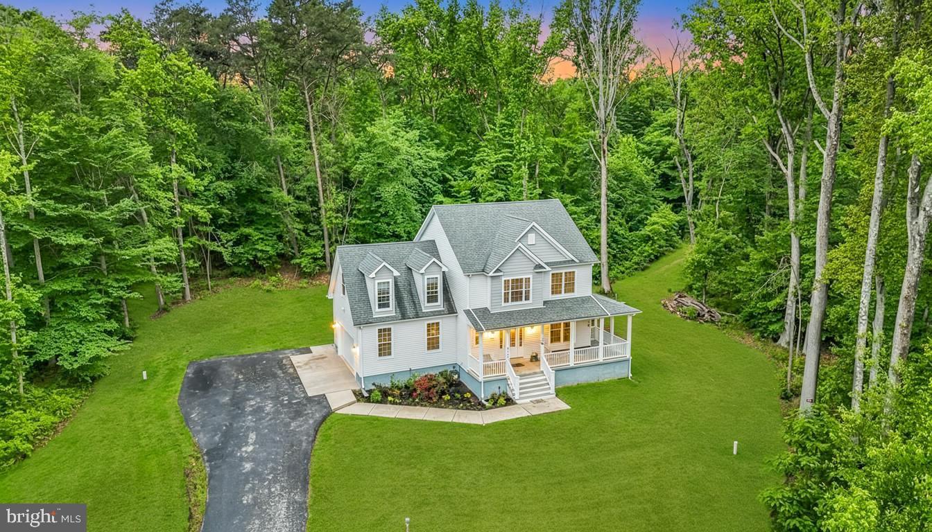 Experience the perfect blend of privacy, modern comfort, and peaceful country living in this stunning newer construction Colonial nestled on a picturesque wooded homesite in Nanjemoy. Situated on approximately 3 private acres at the end of a quiet cul-de-sac, this beautifully designed home offers the serenity of rural living while remaining conveniently located to La Plata, Indian Head Naval Support Facility, Washington, D.C., and some of Southern Maryland’s favorite waterfront destinations.
Step inside to discover a bright and open floor plan designed for both everyday living and entertaining. The spacious family room flows seamlessly into the gourmet kitchen, featuring granite countertops, stainless steel appliances, elegant lighting, and an oversized island ideal for gatherings. Large windows throughout the home fill the space with natural light while showcasing the surrounding wooded views. Plenty of land to add a detached garage and even additional road to access private 3 acre lot.  

The upper level offers generously sized bedrooms, including a luxurious owner’s suite complete with a large walk-in closet and spa-inspired bath featuring a soaking tub, separate tiled shower, ceramic tile flooring, and dual vanities. Convenient upper-level laundry adds to the home’s thoughtful functionality.  The lower level offers a rough in for bath and a secure safe room.

Outdoor living and functionality continue to impress with a large detached shed equipped offering the perfect setup for a workshop, hobby space, storage, home business, or recreational use.

Enjoy the lifestyle that Nanjemoy and nearby Port Tobacco have to offer with close proximity to local waterfront restaurants, marinas, fishing piers, and public boat ramps. Spend weekends dining at the beloved Port Tobacco Marina Restaurant, launching your boat nearby for a day on the water, or enjoying the amenities at Goose Bay Marina.  Mallows Bay Park is a short distance away.  This location is ideal for boating enthusiasts, nature lovers, and anyone seeking a quieter pace of life while still maintaining commuter convenience.

Additional highlights include:

Side-entry 2-car garage
Spacious rear deck overlooking private wooded acreage
Open unfinished basement with rough-in plumbing and future expansion potential
Modern energy-efficient systems and upgraded finishes throughout
Quiet neighborhood setting with abundant wildlife and scenic surroundings
This exceptional property offers the rare opportunity to enjoy newer construction, acreage, modern amenities, and the relaxed Southern Maryland waterfront lifestyle all in one beautiful setting.