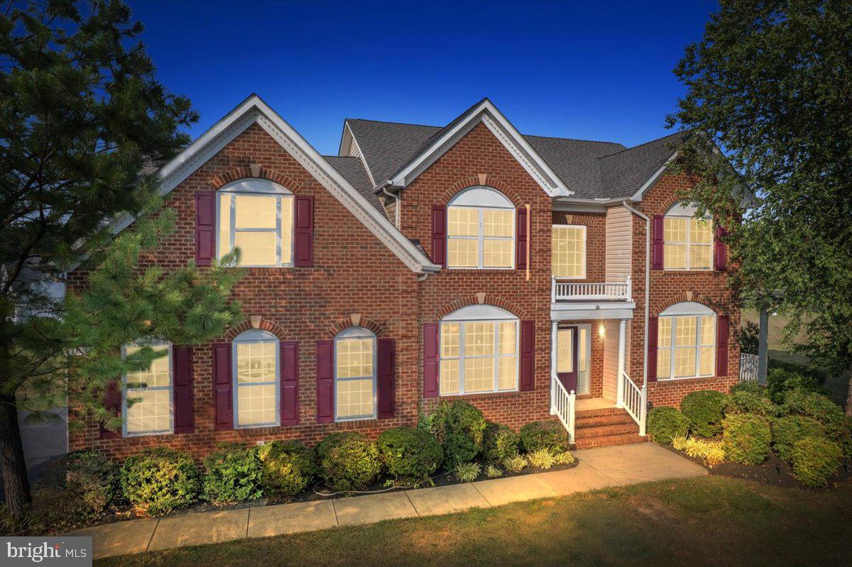 Welcome to 1003 Horse Pen Run in the sought after Farms at Hunting Creek, where community meets luxury. With this home you will find one of the flattest back yards in Calvert County-ready & waiting for your future pool if you desire. You will be wowed by this stately brick stunner, the Sotterley model from Quality Built Homes which offers a unique functional floorplan. You are met with a soaring 2 story foyer, & a staircase in the middle of the home that makes quite an impact. The gourmet kitchen has rich maple cabinetry, granite countertops, a huge island, gas cooktop & double wall ovens-everything you would need to create a fine meal. Attached to the kitchen is a butlers pantry that walks through to your separate dining room for all your entertaining.  Main level also offers the flexibility of a living room or private office.  Cozy up to the fireplace in the family room on those cold winter nights. Gleaming hardwood floors line the entire main level & upstairs hallway. Upstairs you will find so much space-3 good size secondary bedrooms with large closets, & the conveniently located laundry room. The primary suite is massive with a separate sitting room, luxurious bathroom with soaker tub, dual vanities & large tiled walk in shower.  The lower level is fully finished, with separate theatre room, recreation/flex space, 5th bedroom and full bath. There is space for days in this home with over 4000 finished square feet! Located in the middle of the neighborhood, there is quick easy access to exiting.  Living in the “Farms” is an experience. (I live here too) We have tree lined streets with SIDEWALKS, which is hard to find.  We have a playground with gazebo for picnics, a basketball court, soccer field, & a lake that you can fish in. Just don’t disturb our geese & ducks that live here too! We have organized food trucks, community light decorating, & trick or treating like none other. We are zoned for award winning schools & minutes from Prince Frederick for shops & restaurants.  Come see this beautiful gem in this wonderful community for yourself!   Don't miss the virtual tour.