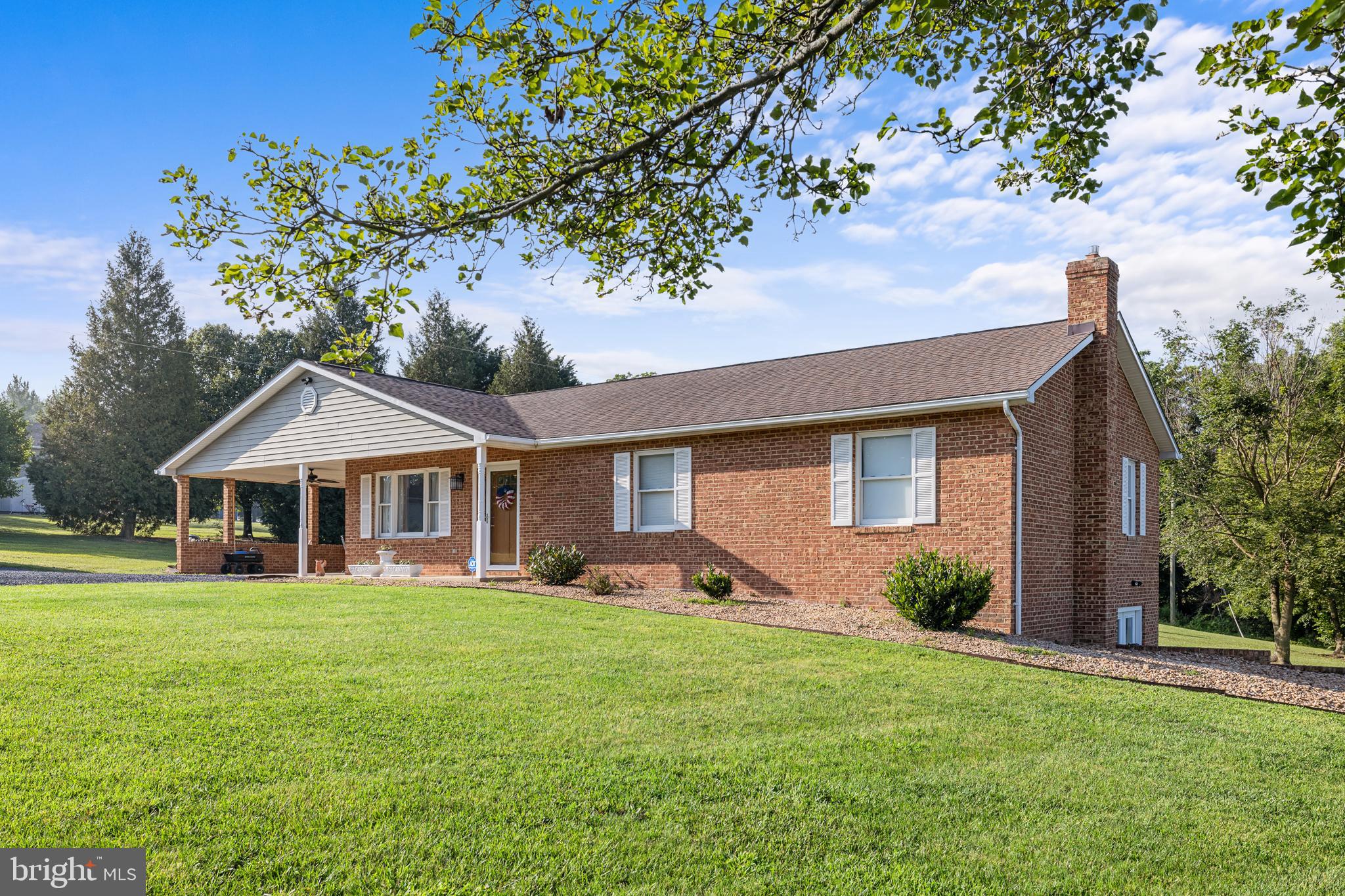 Welcome Home! Well maintained one owner brick home on 1.47 rural acres. 3 bedrooms/2.5 baths on the main level. Carport, spacious deck & side patio. Family Room in basement with gas log stove. Full bathroom off the Family Room.  Large storage/utility room adjacent to Family Room. Updated Master bath. A-1 (agriculture) zoning, no restrictions on pets. ADT Security System