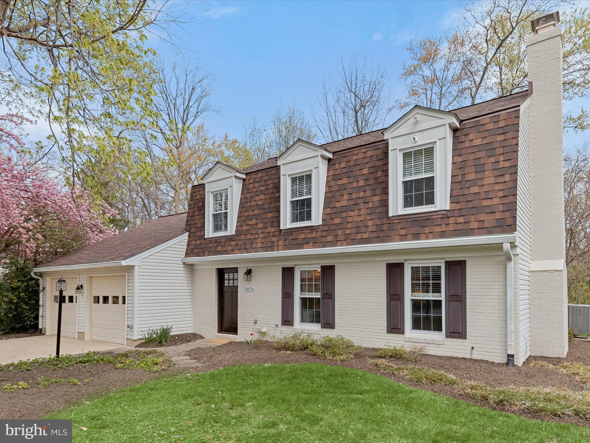 Beautiful brick-front colonial offers 4 bedrooms, 2.5 bathrooms, and a host of stylish updates throughout, all nestled in the sought-after Village of King's Contrivance Columbia community. Major updates include a remodeled kitchen and baths, and the roof (2017).   The main level features gleaming hardwood floors in the living and dining rooms, while the renovated kitchen boasts granite countertops, a custom tile backsplash, and stainless steel appliances, and adjoins the family room. Enjoy year-round relaxation in the enclosed porch with rich mahogany flooring.   A convenient powder room and laundry area complete the main level.  Upstairs, the spacious primary suite features a luxuriously renovated bath with a glass-enclosed shower and custom tilework. Three additional bedrooms and an hall bath offer ample space for family or guests.   Backed by serene woods with access to nearby hiking trails, this home provides a perfect balance of privacy and convenience.   Located just minutes from major commuter access routes 32 and 29, offering easy access to Columbia’s endless dining, shopping, and entertainment options.