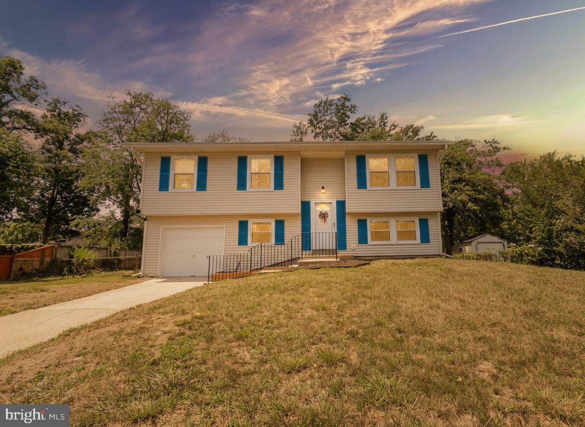Completely renovated and ready for its new owners! This 4 bedroom 2 bath split foyer in the Carrington neighborhood has been updated from top to bottom, so all you have to do is move in. The main level features an open floor plan with a fully renovated kitchen, brand-new LVP flooring, and new LED recessed lighting that gives the home a bright, modern feel. Both bathrooms have been beautifully updated, and a brand-new washer and dryer are included for added convenience. Outside, you'll find a fully fenced backyard that's perfect for entertaining, kids, or pets, along with a garage with an automatic garage door opener. To top it all off, the home has a brand-new roof, giving you one less thing to worry about for years to come. This home is truly turn key ready- all you have to do is move in! Schedule your showing today and make it yours