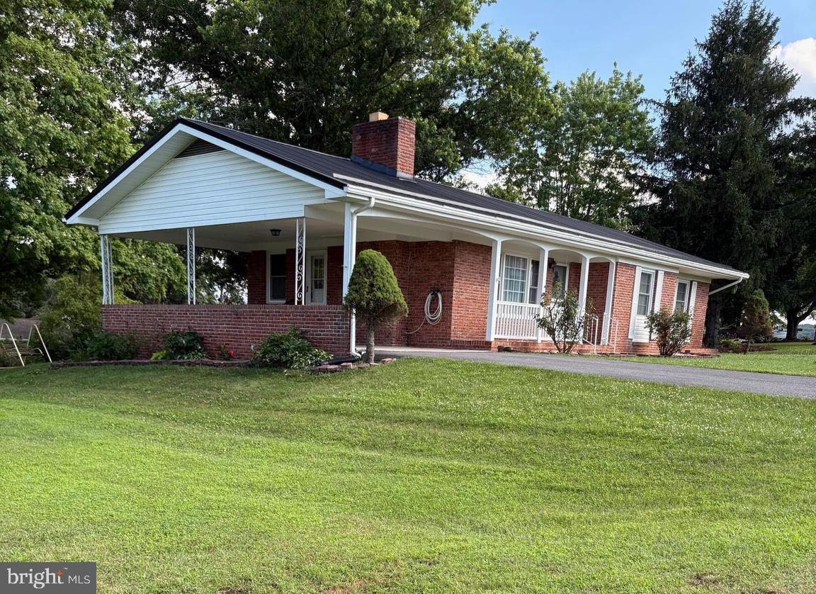 Beautiful, newly remodeled home in a well established subdivision.  Located near town, near hospital, post office,  schools and dining.  New metal roof, new windows, beautiful hardwood floors, freshly painted., new bathroom upgrades.  Window blinds and curtains convey.  Partially finished basement.  Don't  miss out on this opportunity.  Beautiful home, lawn and location!!