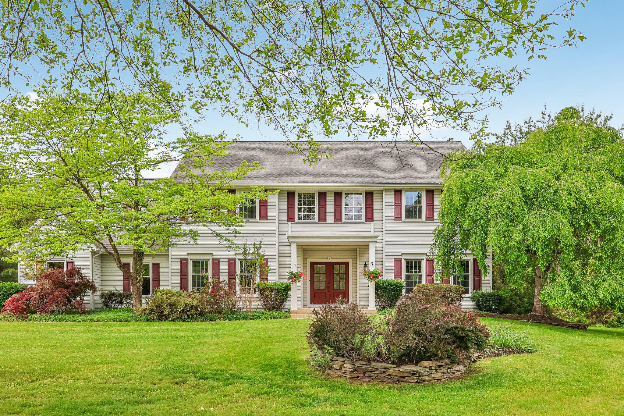 Nestled in the charming Canal Walk subdivision in desirable Solebury Township, this beautiful Colonial home offers a perfect blend of comfort and elegance. With 4 spacious bedrooms and 2.5 bathrooms, this residence spans over 3,300 square feet, providing ample space for relaxation and entertaining. Step inside to discover a warm and inviting interior beginning in the spacious foyer, with beautiful hardwood flooring that continues into the dining room and living room. The traditional floor plan includes a formal dining room to the left of the foyer, and formal living room off to the right.  Two guest closets and a half bath off the foyer provide convenience and ease for family and guests.  Continuing to the back of the home is a large, bright kitchen and dining area, fully equipped for preparing everyday meals and holiday feasts with lots of storage, including two pantries.  A  spacious family room with a wood-burning fireplace is directly off the kitchen. Whether you are gathering around  the fireplace in the family room for cozy evenings, or entertaining guests during the holidays, this wonderful home has everything you are looking for. Enjoy the convenience of a main-floor laundry room with outside access to a blue stone patio. The 1.24-acre lot offers a level, landscaped yard with a serene garden view, ideal for outdoor activities or peaceful relaxation. The patio provides a perfect spot for al fresco dining or morning coffee, and the 3-season porch off the family room provides that outdoor ambiance, regardless of the weather.  A 3-car garage, with extra space for a workshop, and additional driveway parking, convenience is at your fingertips.  Walk up the center staircase to an open and airy 2nd floor hallway.  Retreat to the primary suite, complete with 2 walk-in closets and a spa-like bathroom featuring a soaking tub and a stall shower. A spacious bonus room adjoins the primary bedroom.  Use it as an office, a reading room, hobby room, the possibilities are endless.  Bedrooms two, three and four are on this level, and are all generously sized.   Access to the Delaware Canal walking path is a short distance from the home.  The vibrant town of New Hope is only 2 miles away.  Enjoy the many restaurants, experience town events, like weekly fireworks over the river during the summer months or take stroll over the Delaware River bridge to Lambertville, NJ. This ideal location also provides easy access to NJ, and all that Bucks County has to offer.  This home is not just a place to live; it's a sanctuary where memories are made.  Experience the perfect blend of comfort, convenience, style, and tranquility in this exceptional property.