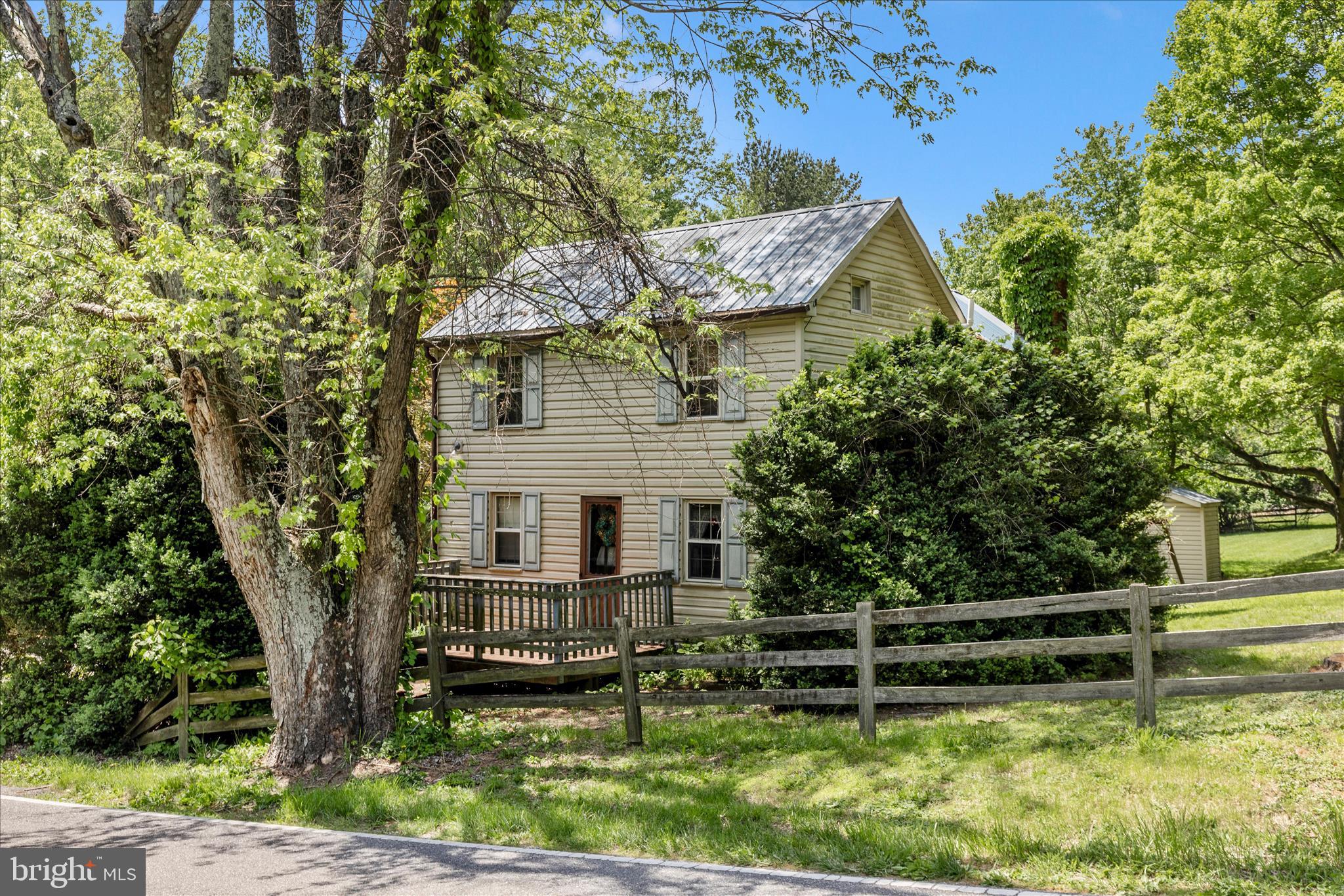Live your dream! Property  offers a total of 3 bd, 2 full baths including guest house space. Nestled on just over 4 acres, possibly a great space for a mini farmette.  Charming post-civil war home, built in 1878, has so much character! Step into yesteryear entering the traditional floor plan which seamlessly connects cozy living spaces.  Original house plans and addition plans along with other documentation of very interesting facts about this home which provides a perfect retreat-like experience. The main bathroom has a sauna closet. The private peaceful outdoor space  can be an especially relaxing atmosphere.  Parking is a breeze with a horseshoe driveway, ensuring easy access for you and your guests.  Updates in the 80's and 2008-2010.  This is a must see!