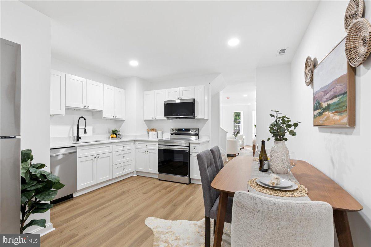 Welcome to 822 E. North Ave., a beautifully reimagined home in the heart of Baltimore. This stunning 5-bedroom, 3-bath renovation blends modern style with everyday comfort. Just minutes from Baltimore's top attractions and a quick trip to Penn Station, this location delivers both convenience and lifestyle. Step inside to an open, airy layout designed for entertaining and effortless living. Enjoy sleek stainless steel appliances and a sizable fenced-in backyard perfect for gatherings, relaxing, or letting the kids run free. Retreat to the dream-worthy primary suite featuring a spa-inspired bathroom you'll never want to leave. With five bedrooms, there's room for everyone, whether you need space for guests, a home office, or both. Completely renovated from top to bottom with all-new systems, this home is grant eligible and priced to allow the next homeowner to step into instant value and potential equity.