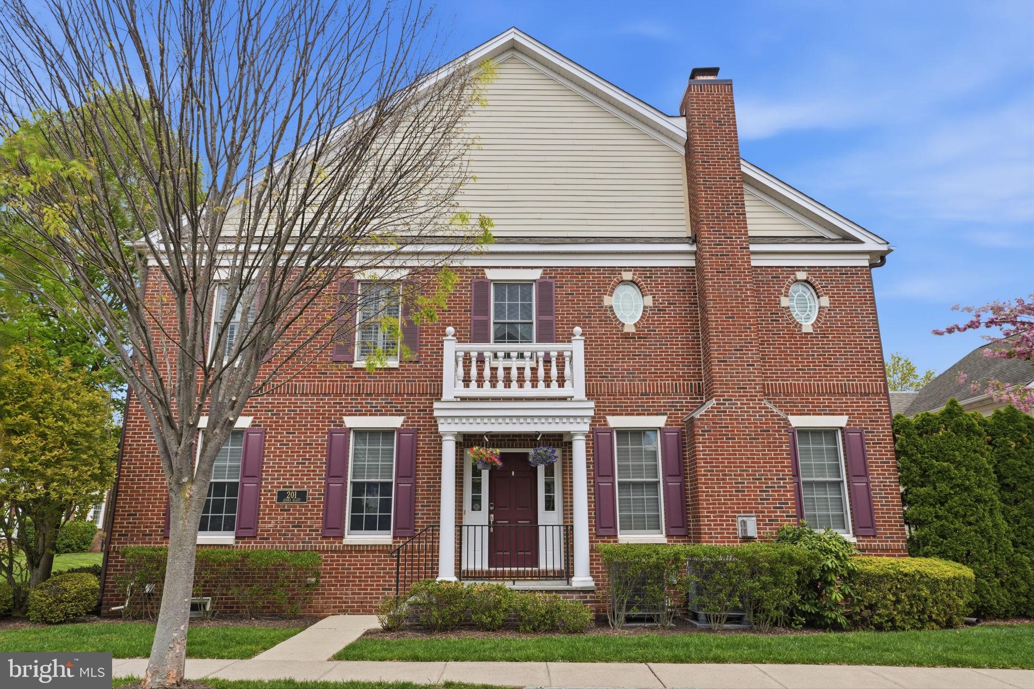 Welcome to 201 Jenks Alley, an exceptional brick end-unit townhome offering a perfect blend of sophistication and comfort in the prestigious Newtown Walk community, ideally located just steps from the charm and vibrancy of Historic Newtown Borough. Offering the perfect balance of elegance, space, and low-maintenance living, this stunning 3-bedroom, 3.5-bath residence delivers the feel of a single-family home within an intimate, boutique-style community. Thoughtfully designed with 9-foot ceilings on both the main and second levels and 8-foot ceilings in the lower level, the home is filled with natural light from an abundance of windows, creating a bright and airy atmosphere throughout. Recently refinished hardwood floors (2025), recessed lighting, and detailed crown molding enhance the home’s sophisticated appeal. The gourmet kitchen serves as the heart of the home and is beautifully appointed with 42” cabinetry, granite countertops, a tiled backsplash, stainless steel appliances, and a center island—perfect for casual dining or entertaining. An elegant butler’s pantry provides additional prep and storage space, seamlessly adjacent to the kitchen and direct entry from the garage enhancing both function and flow.
The open-concept layout continues into the living and dining areas, offering a warm and inviting setting ideal for everyday living and hosting guests. The adjacent family room is highlighted by a gas fireplace with remote control and a built-in blower for added warmth, creating a comfortable and cozy environment year-round. Upstairs, the luxurious primary suite is a true retreat, featuring a cathedral ceiling, decorative chair-rail molding with panel wainscoting, plantation shutters, and a spacious walk-in closet with custom built-ins. The en-suite bath includes a double vanity, soaking tub, and a beautifully tiled shower with built-in seat. Additional bedrooms are generously sized with ample closet space and flexibility for family, guests, or a home office. A second-floor laundry room with wash sink adds everyday convenience. A standout feature of the home is the private office, thoughtfully positioned for maximum privacy and enhanced with custom built-in bookshelves—ideal for today’s work-from-home lifestyle. The professionally finished lower level offers incredible versatility, complete with recessed lighting, decorative molding, a kitchenette, bonus room /guest bedroom, full bathroom, and abundant storage—perfect for extended stays, recreation, exercise, or media space. Outdoor living is equally impressive with a maintenance-free composite deck offering privacy and a retractable awning, creating the perfect setting for relaxing or entertaining. Additional highlights include a two-car garage with epoxy flooring, electronic access at both the front door and garage, and two high-efficiency HVAC systems replaced in 2023 and separate heat pump replaced in 2025. Residents of Newtown Walk enjoy a well-managed, fiscally sound HOA, beautifully maintained grounds, and access to a scenic walking trail. This intimate community is known for its exclusivity, timeless architecture, and exceptional location. Situated within the award-winning Council Rock School District, this home is just a short stroll to Newtown Borough’s renowned restaurants, boutique shopping, and charming cafés. Nearby shopping centers provide everyday convenience, while easy access to major commuting routes allows for seamless travel to Philadelphia, Princeton, and New York City.
Also, enjoy outstanding access to nearby parks, including Tyler State Park just minutes away with scenic trails, biking, and kayaking along Neshaminy Creek. Closer to home, Helen Randle Park offers playgrounds, sports fields, and walking paths, while Roberts Ridge Park provides a convenient neighborhood setting for casual outdoor enjoyment. A rare opportunity to own in one of Bucks County’s most sought-after communities.