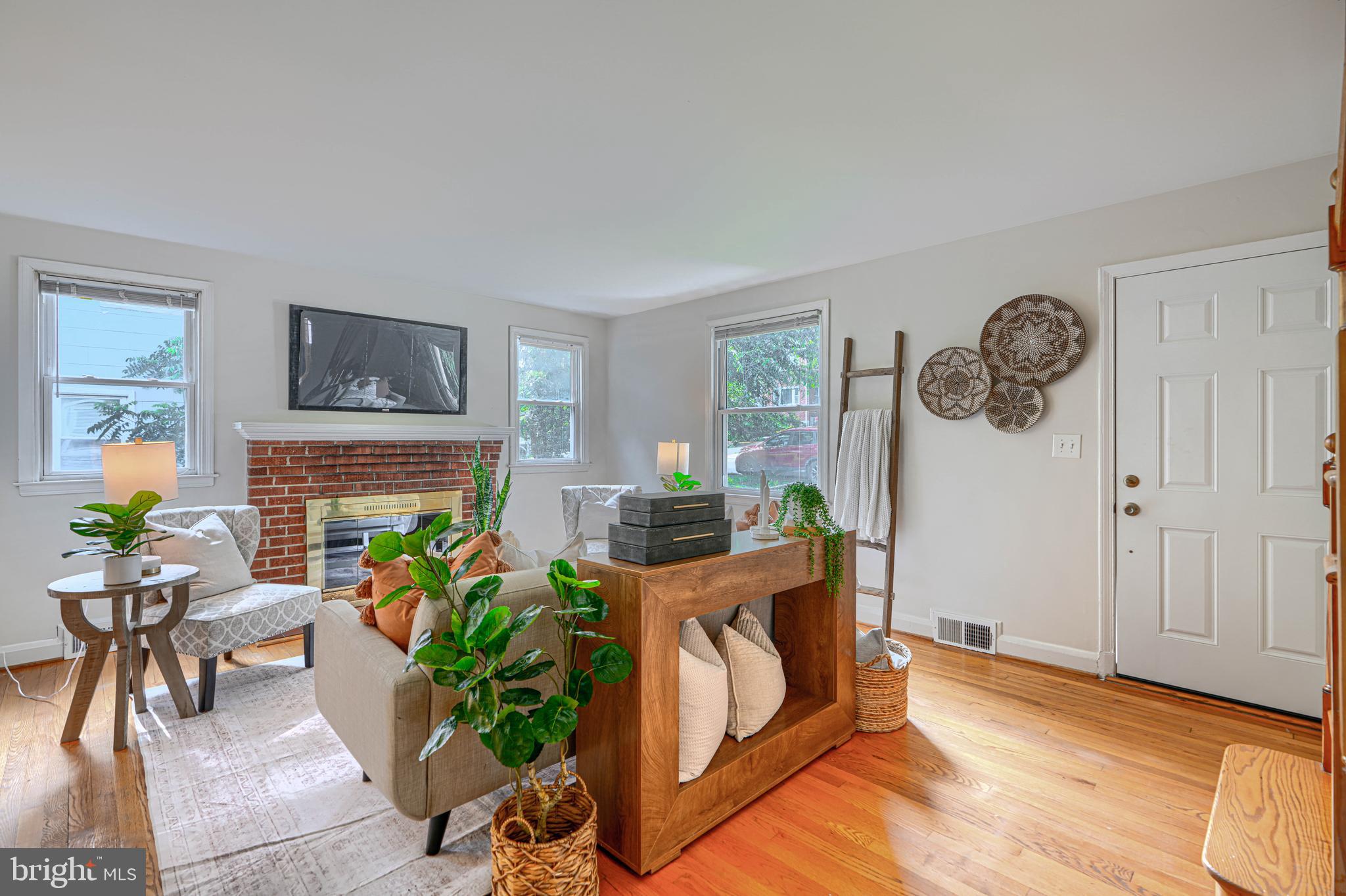 Welcome home to this beautiful 3BR/2BA home with off-street parking, fully finished basement, rear patio, and much more! This cape cod has undergone many recent upgrades to modernize it while still maintaining its 1950s charm. As you enter the home via the front porch you will notice that the entire exterior has been repainted. The bright and  spacious living room includes lovingly maintained original hardwoods accentuated by a brick wood-burning fireplace with mantle. The kitchen has been recently upgraded including all new stainless steel appliances, backsplash, and brand new countertops. There is a convenient full bathroom at this level that has a new vanity and a beautiful black and white tile scheme as well as all new plumbing trim. There is a main level bedroom and a large dining space as well as a coat/storage closet. The upper level includes 2 more large bedrooms each with generously sized closets, and a central, fully renovated bathroom featuring custom bath tile surround and a linen closet. The fully finished, water-proofed basement offers brand new carpet, sump pump, and recessed lighting. This large finished space offers endless opportunities to customize the space, be it game room, family room, home office, gym, or additional bedroom. The basement includes another storage closet, a laundry room with side-by-side washer and dryer and walkout access to the rear patio, and a utility room. The rear of the home provides a wooded oasis and includes a large concrete/brick patio - perfect for enjoying the serene setting. The small storage shed conveys. This home offers central heat and ac, and has been expertly refreshed offering an affordable, move-in ready home. Located less than a mile from 695 and only a couple miles from downtown, your commute or next adventure will be a breeze!