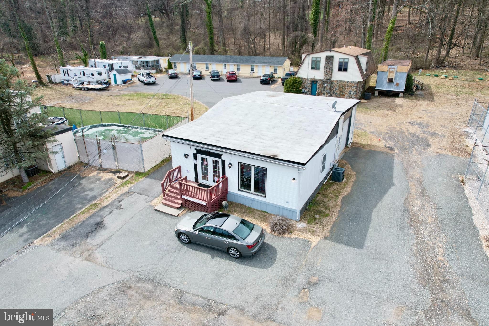 REDUCED!  Income Property opportunity, with great exposure on Belair Rd in Kingsville.  Property includes 10 rented residential units and 1 leased retail store.  Plus potential rent from 2 additional residential trailer licenses, along with a storage area and storage trailer. Septic System was replaced in 2024 using BAT technology.  Spring fed well is shared with an adjacent property.  Cell tower (on property) and Van Dorn Pools lot and building are NOT part of this sale.  Zoned BM.