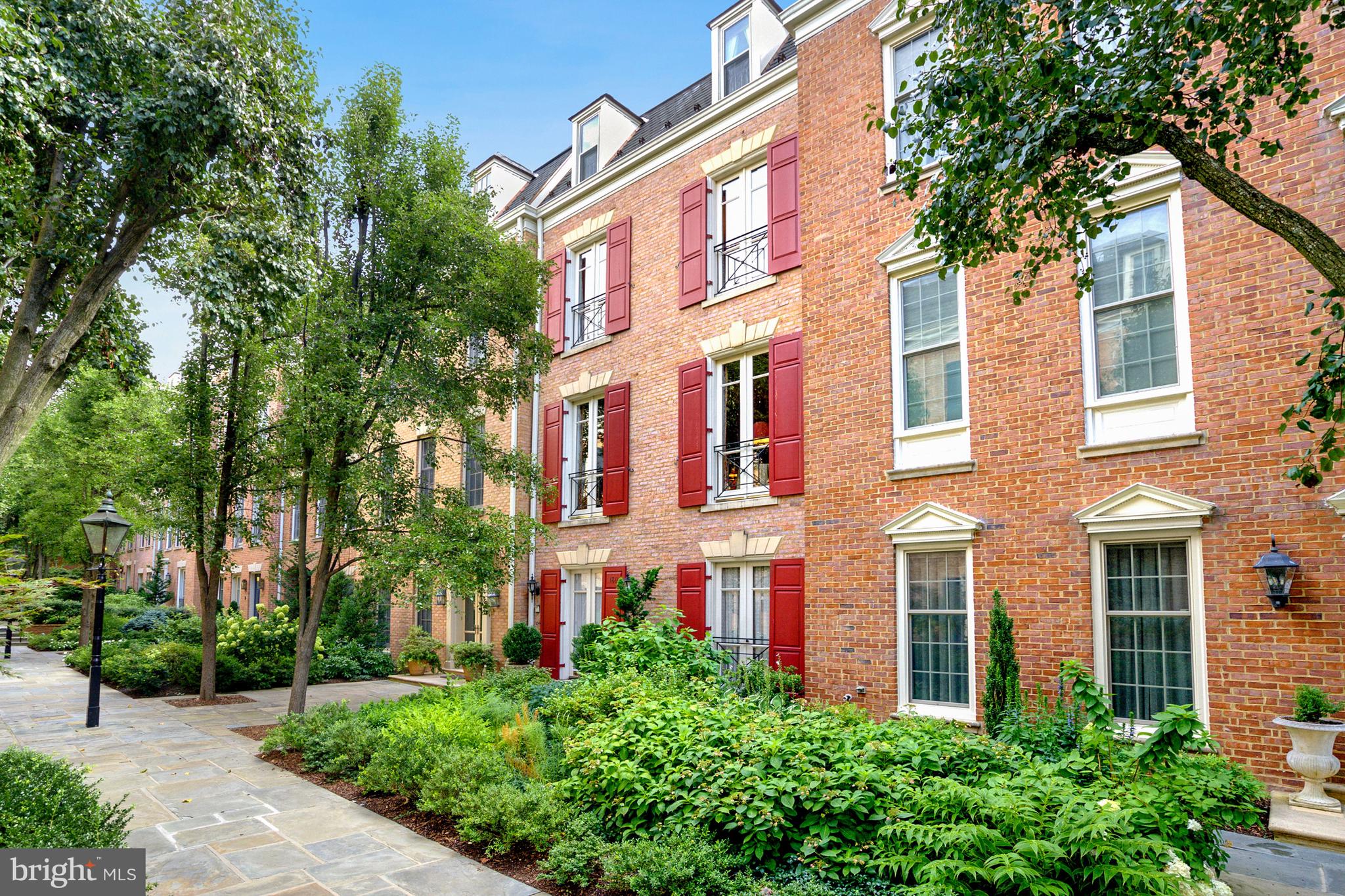 Rarely available Kalorama Square townhome! Kalorama Square is a private, gated, enclave of 25 grand townhomes with a secure underground parking garage, 24/7 security and concierge service located in the heart of Kalorama. Residents not only receive the advantages of apartment living, but also the benefits of residing in a full scale home. With approximately 4,600 square feet of finished living space, this handsome residence is beautifully appointed with custom finishes throughout. Five elegant levels with features including ten foot ceilings, graciously scaled rooms, gorgeous french windows and elevator access from the garage to the uppermost floor, providing the perfect floor plan for full-scale entertaining and everyday living. A gorgeous reception hall, beautiful custom kitchen with breakfast room and banquet sized dining room with french doors and windows overlooking the private terrace are on the main level. A stunning, open stairway leads to the grand living room with fireplace and wet bar; a gracious, paneled library with built-ins is also on this level. The primary suite, including primary bedroom, sitting room (or second bedroom) plus two full baths occupy the third level. Two additional bedrooms, each with ensuite baths, are on the fourth level. A laundry room and staff room/bonus room with facilities are on the lower level, which also accesses the underground parking garage, with parking for two. Kalorama is known for its beautiful architecture, historic homes, diplomatic residences and quiet tree lined streets. With an outstanding “walk score” of  98, the Kalorama Square location allows residents to stroll to the metro, the many restaurants and shops of Connecticut Avenue, Dupont and Adams Morgan, and nearby beautiful parks and trails (including adjacent Mitchell Park and Rock Creek Park). Downtown DC is just blocks away, and commuters are also able to easily get to Virginia, Maryland and all area airports. Kalorama’s close proximity to downtown Washington, paired with its stately and welcoming ambiance make it a remarkable neighborhood in the nation’s capital - a tucked away and serene location that is truly right around the corner from all one can need or desire.