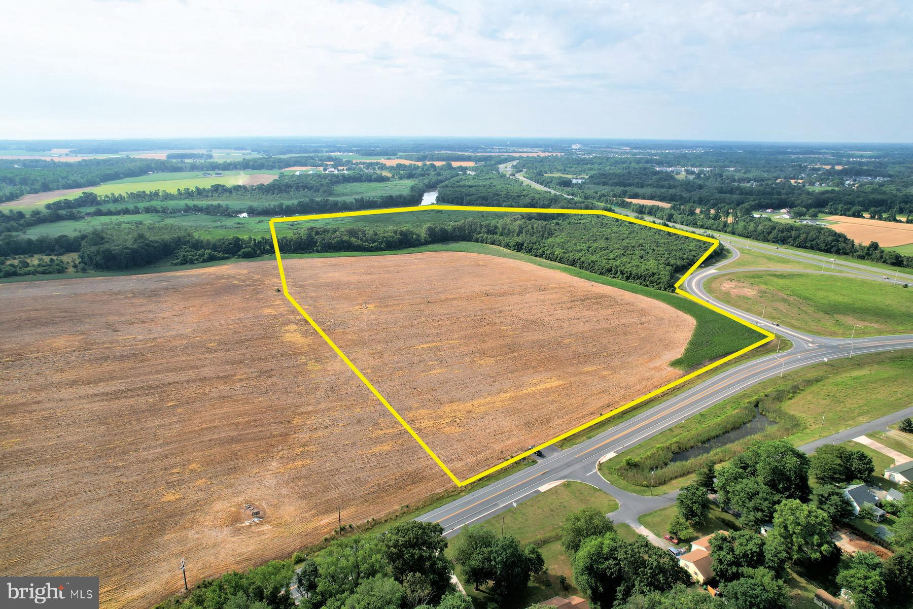 Premier Opportunity for Development ideally located east of Route 1 just south of New Wharf Rd. with direct access off of the NE Front Street Milford Bypass.  79.30 +/- Acres with direct frontage on Coastal Hwy, New Wharf Rd. and The Mispillion River.  Part of the original 96+/- Acres was purchased by Del DOT to build the Milford Bypass and DelDOT has approved and installed an entrance to the farm off of New Wharf Rd.  Approximately 37 +/- acres is currently being farmed-Please do not disturb crop.  Excellent location  close to the Bayhealth campus, major commercial development, hotels and restaurants.