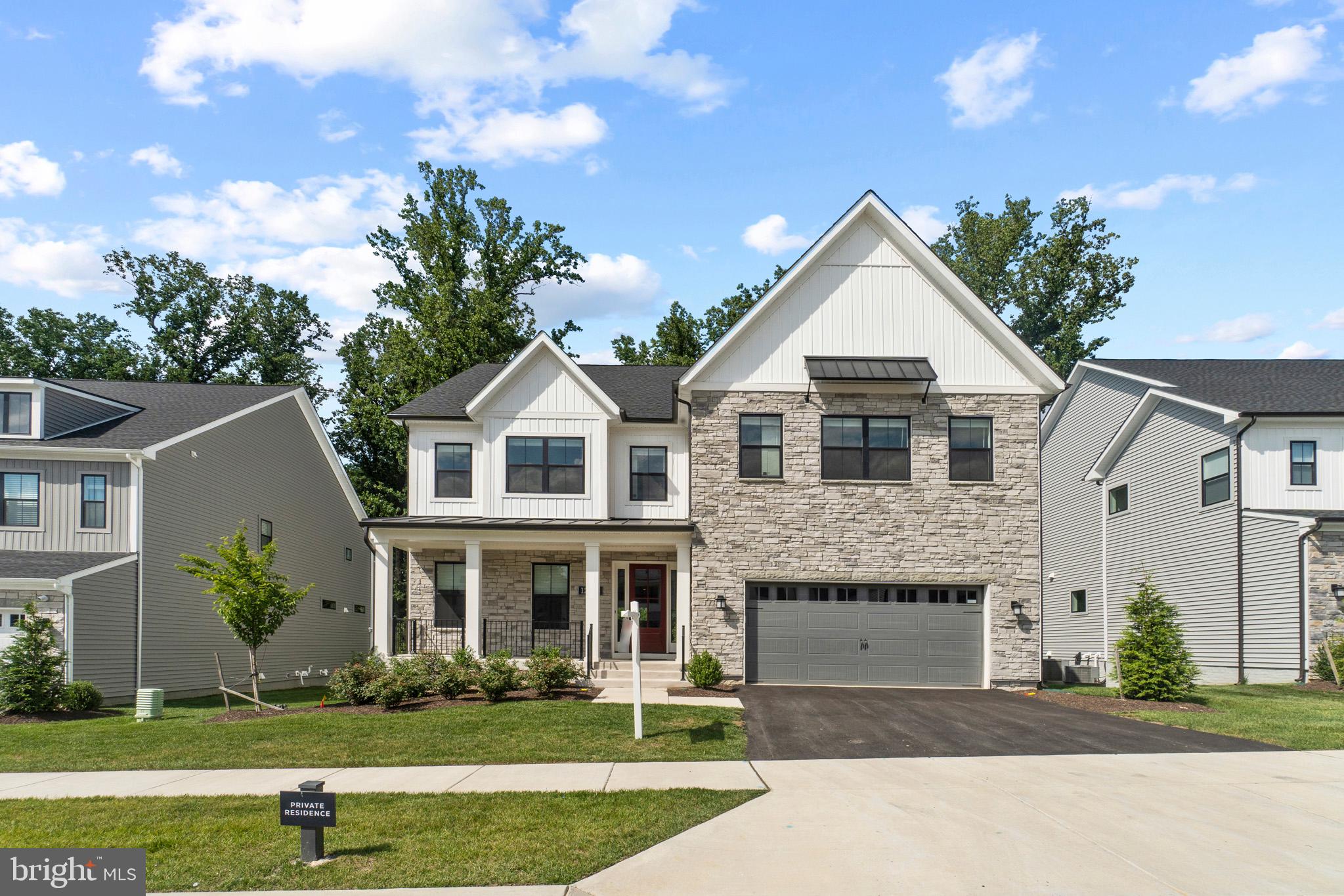 Welcome to 12415 Potomac Hunt, an outstanding home for the most discerning buyer. This is more than a move-in ready home, 12415 Potomac Hunt offers a turnkey lifestyle emphasizing meticulous attention to detail without sacrificing comfort.

This Atlin Modern Farmhouse built by Toll Brothers is 1 year and old boasts tons of unique character and charm. Luxury finishes abound throughout the open floor plan. Hardwood flooring spans the open main level from the private office in the front, through the dining area in the rear. No detail has been overlooked, especially when it comes to the kitchen; Gourmet 6 burner stove, wall oven, upgraded countertops, energy star appliances, an abundance cabinet space, walk-in pantry, and breakfast bar.  The dining room is located just off the kitchen and can accommodate an oversized dining table with views of the serene, wooded area behind the home.  Wind the day down in front of the gas fireplace or step outside to the covered deck before heading upstairs to your private retreat. 

The upper level features a welcoming second family room situated between the 4 generously sized bedrooms. The enviable primary suite features dual walk-in closets providing a small hallway to your private 6-piece bath.  With oversized vanities situated on either side of the bath, the whole room is brought together by the 2 entry, dual headed shower, and soaking tub. Head back out to the family room and across the way you'll find a second bedroom with an ensuite bath.  Bedrooms 3 and 4 are joined by a convenient jack-jill bathroom.  Lastly the amply sized laundry area (with access to the attic) rounds out the upper level.

Return to the wide staircase and go down to the finished lower level. This flexible space includes a true 5th bedroom, full bath, utility/storage room, and a rec room with access to the rear yard. Don't forget to check out the garage. The 3-car garage has one space with electric charging for your Tesla and another prewired.  Schedule a tour today, you won't regret touring this incredible home.