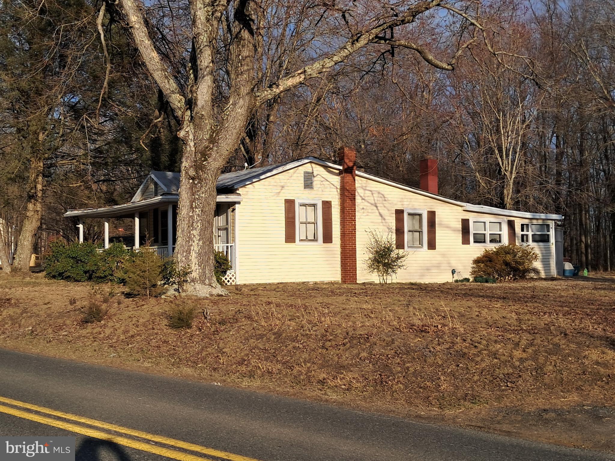 Coming online April 2, 2025- Great location for this project home on 3.2 acres on this level wooded and open land. House currently rents for $1500 per month .Needs updating.   Well and septic 1992.  1 old well with hand pump still works. Newer well is cement cased and located a few yards away.  All buildings convey. Beautiful wooded large oaks and large side yards to left and right of home.  See pictures- Approx 1 acre open. Very Sought after area.  Only 5 miles from I 95. More pictures when tenant moves out end of month.
 Old cars will be removed from back yard prior to settlement belong to neighbor. .  Multiple offers recieved
SOLD AS IS\Grass will be cut prior to closing